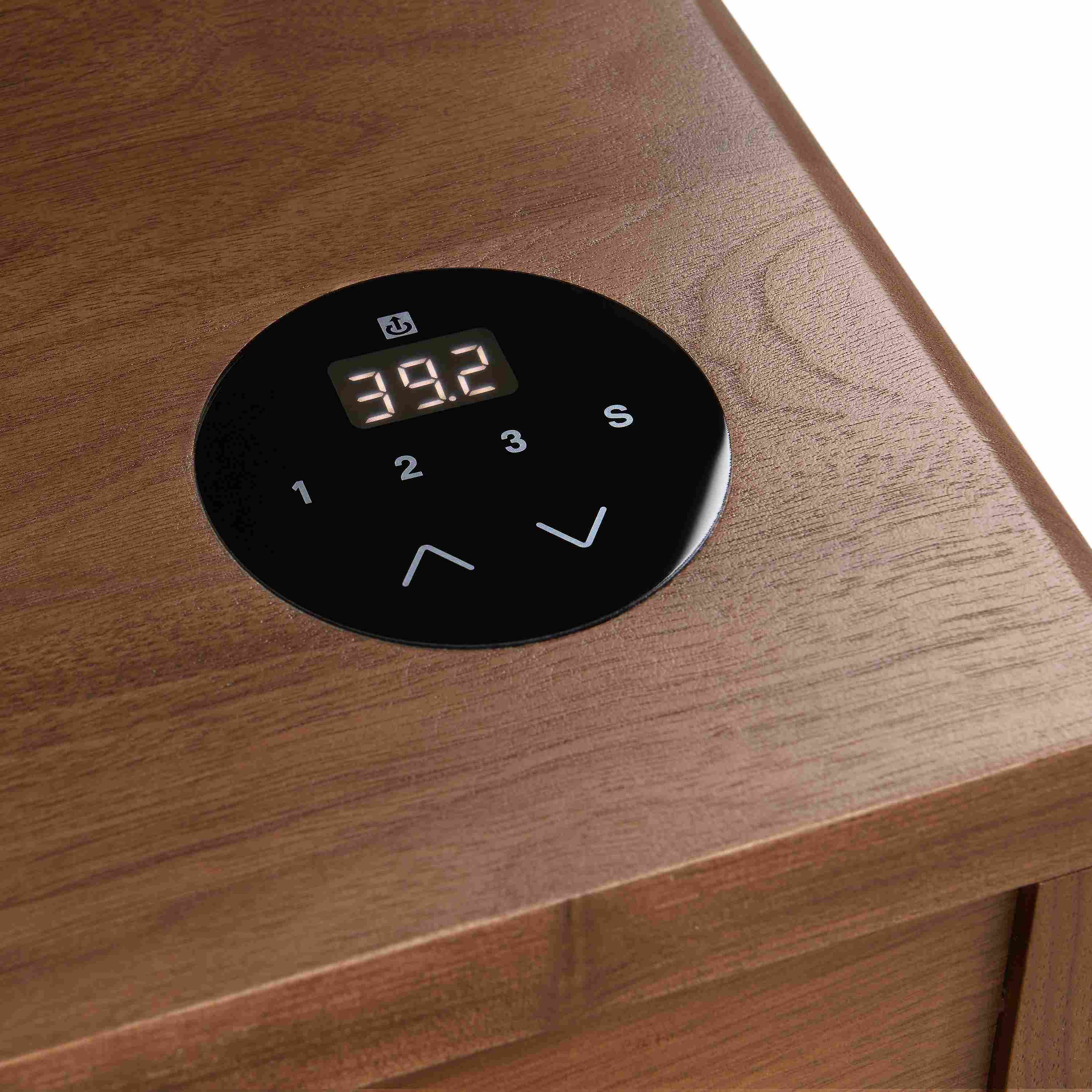 Detail on control button on a Lincoln 72-wide adjustable standing desk in walnut.