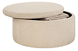 open detail of lind 36-round storage ottoman in dornick ivory fabric.