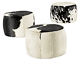 Angled view of Lind 20 diam 16h Round Ottoman in Cowhide Black.