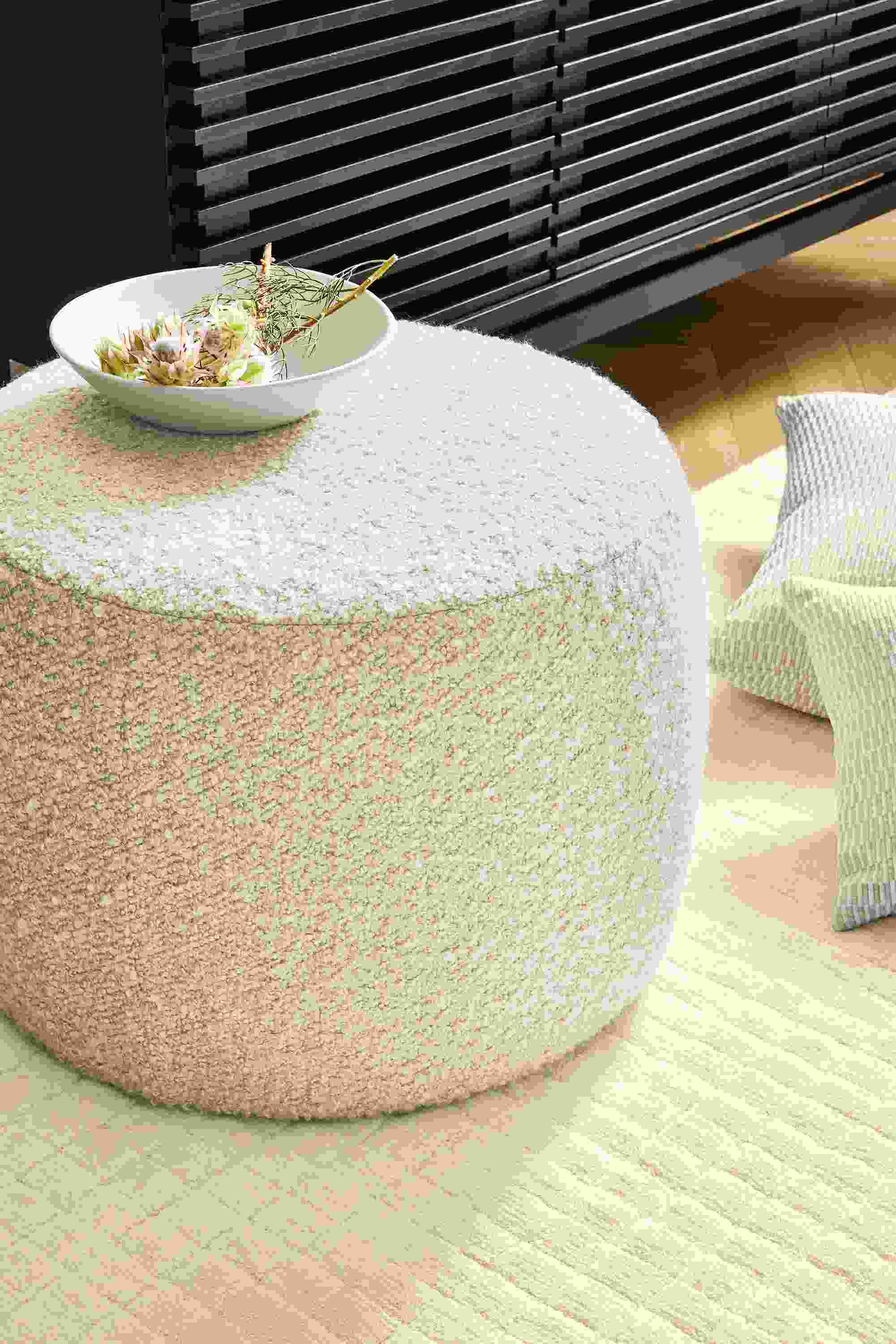 Detail of Lind 20-round ottoman in Dornick Ivory fabric.