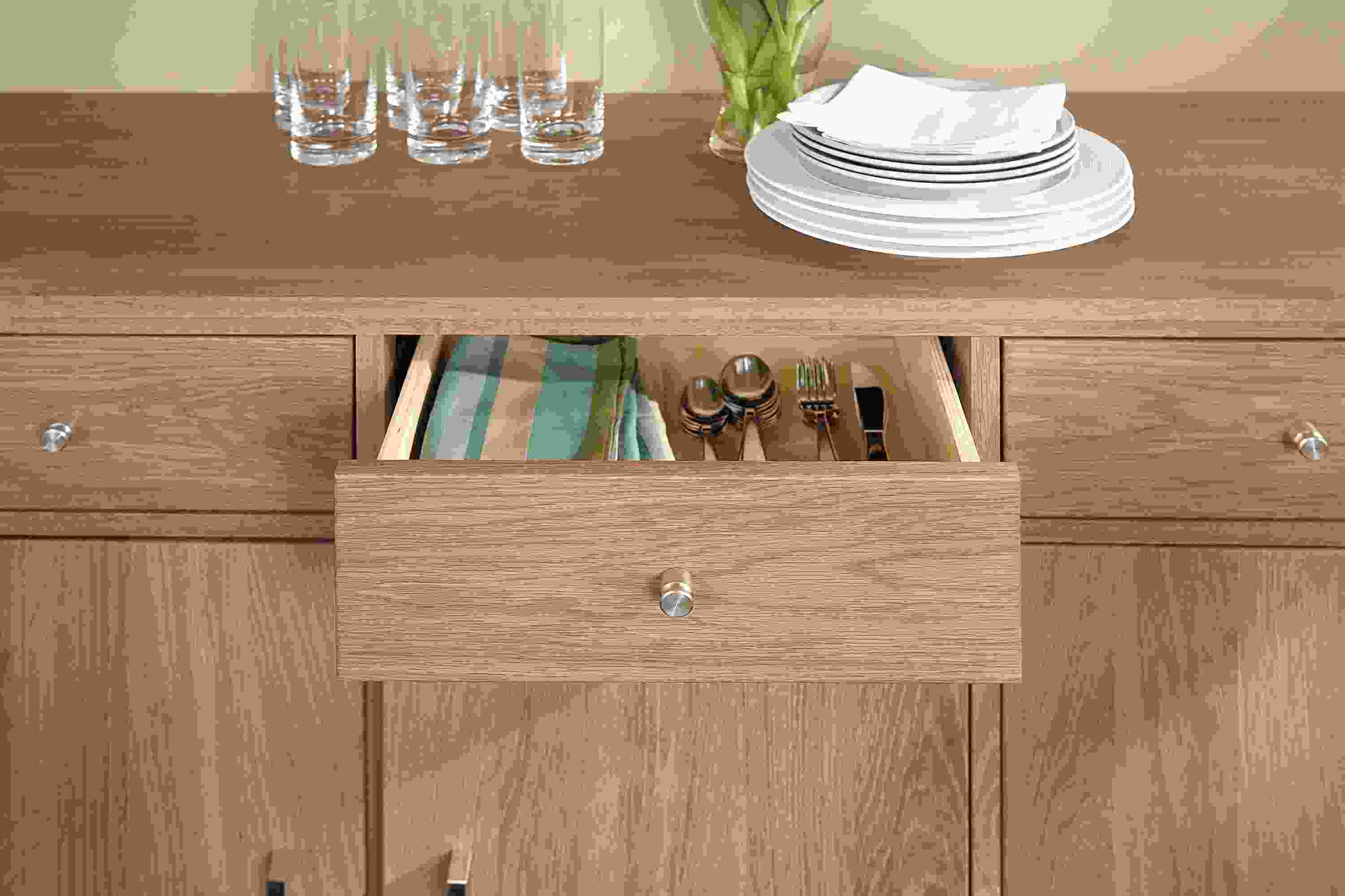 Close-up of Linear 74-wide cabinet in white oak showing middle drawer open.