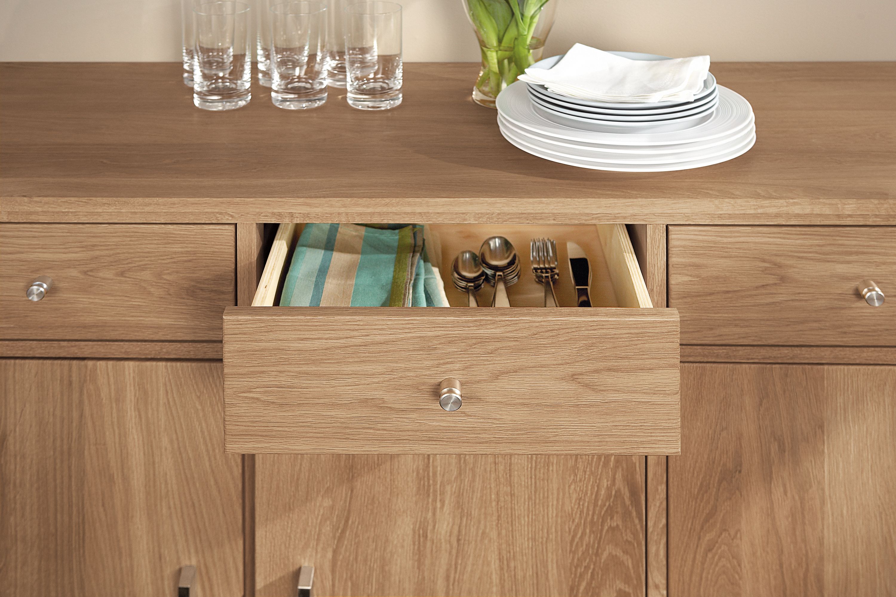 Close-up of Linear 74-wide cabinet in white oak showing middle drawer open.
