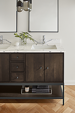 detail of linear vanity with charcoal stain and cambria quartz top in bathroom.