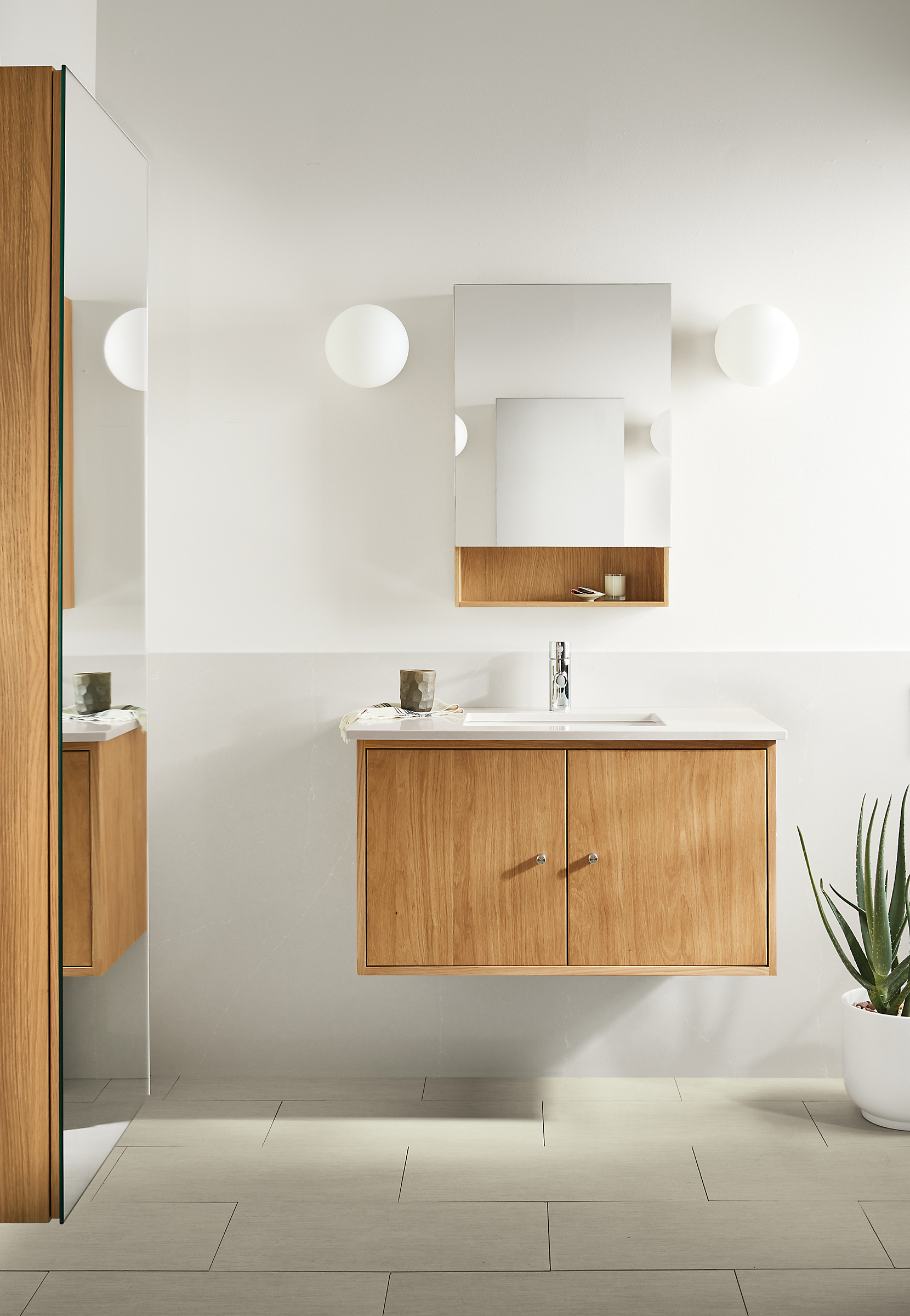 Bathroom with Linear 36-wide floating vanity in white oak and light grey quartz and Bridger 20-wide medicine cabinet.
