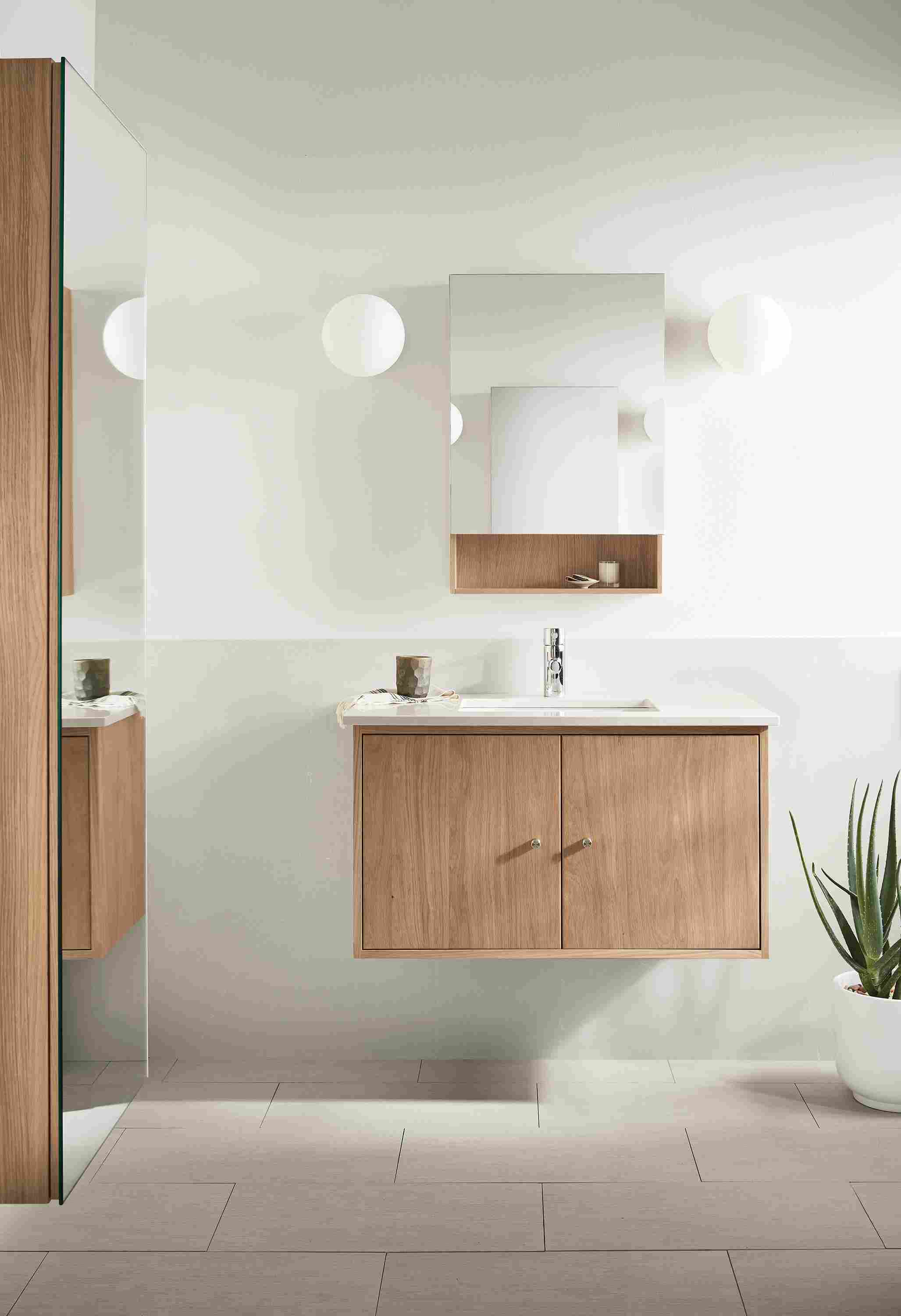 Bathroom with Linear 36-wide floating vanity in rye on red oak and light grey quartz and Bridger 20-wide medicine cabinet.