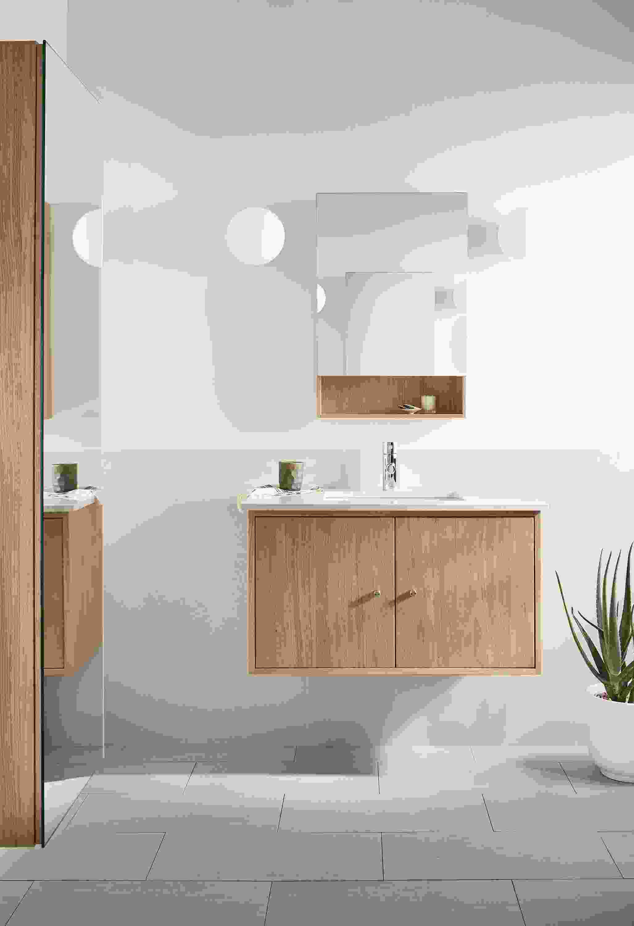 Bathroom with Linear 36-wide floating vanity in rye on red oak and light grey quartz and Bridger 20-wide medicine cabinet.