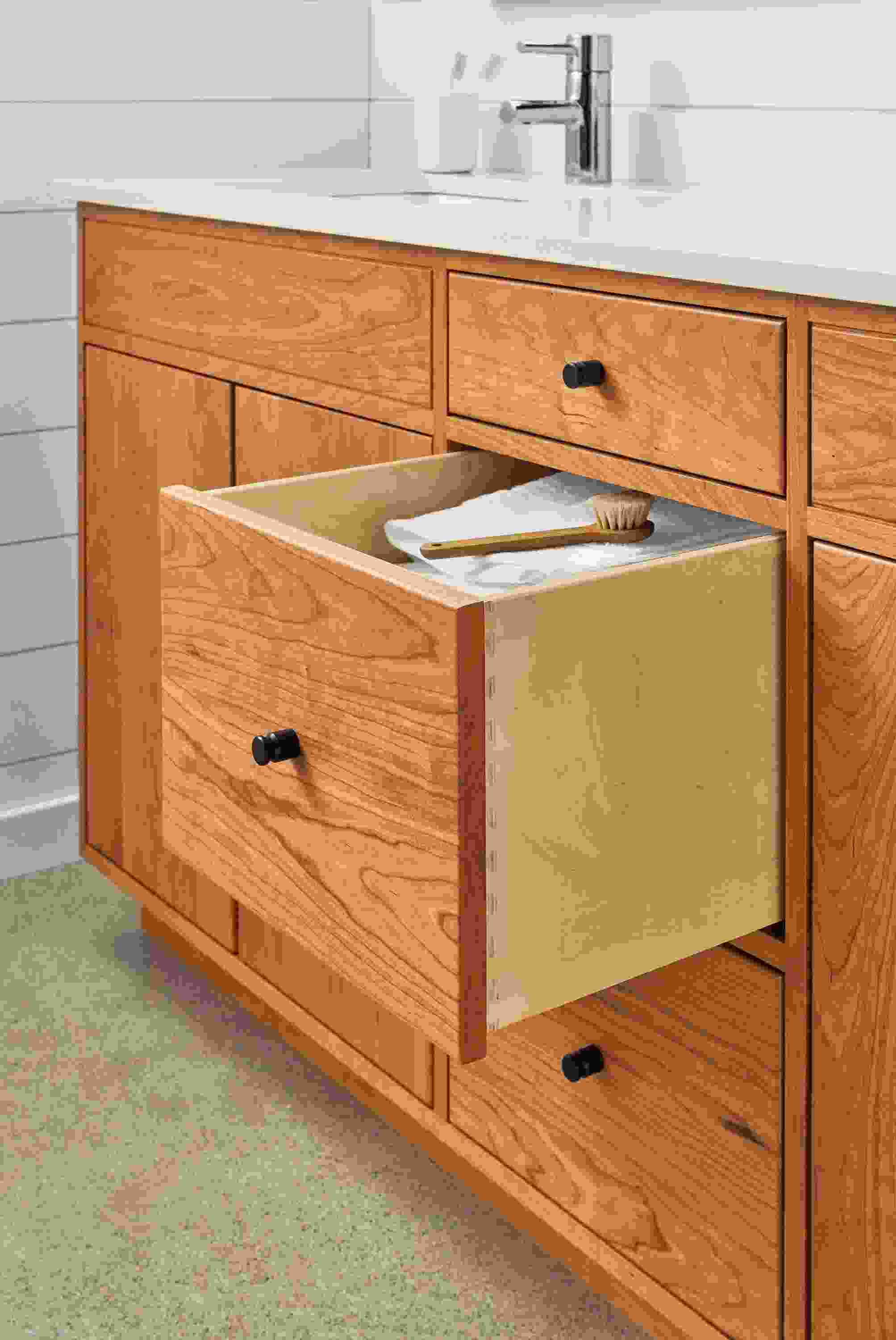 Linear bathroom vanity in cherry.