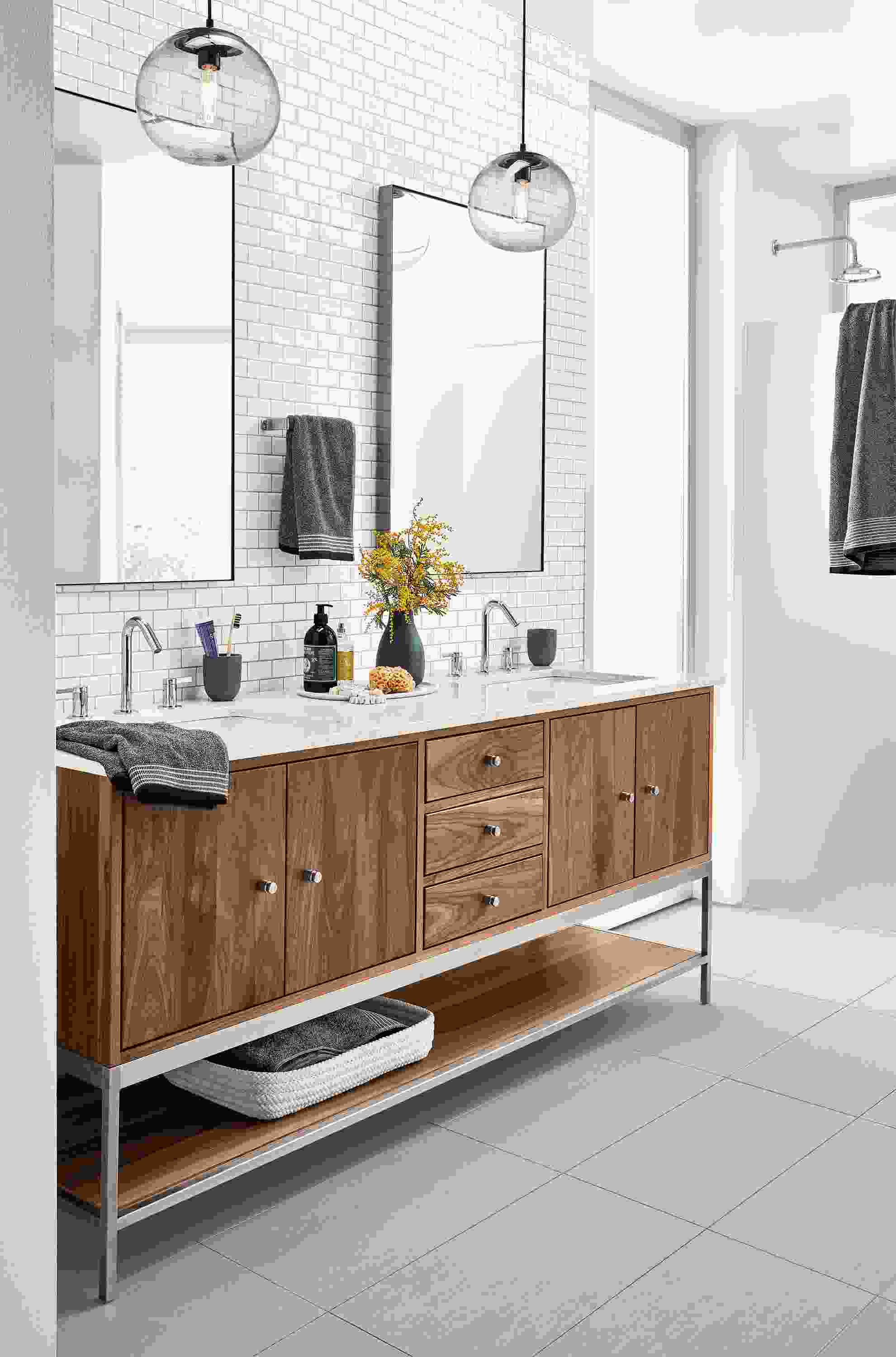 Bathroom with Linear double sink vanity in walnut and stainless steel.