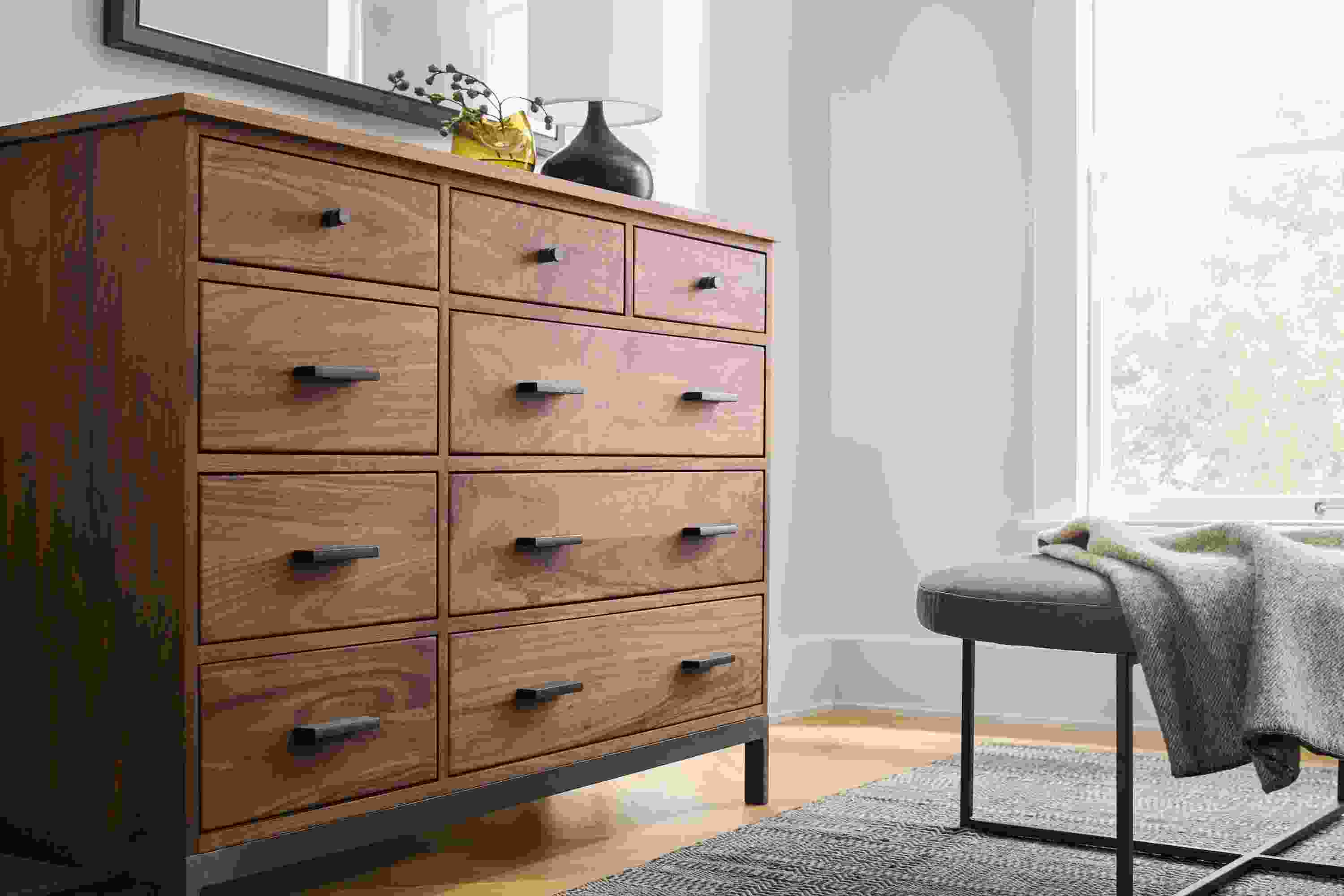 Detail of Linear walnut nine-drawer dresser.