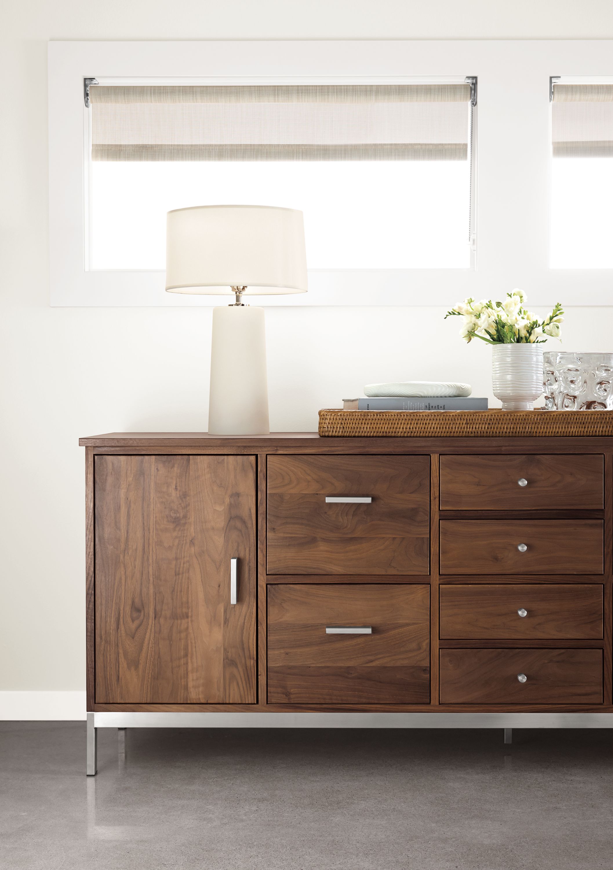 Office with Linear office storage with steel base in walnut.