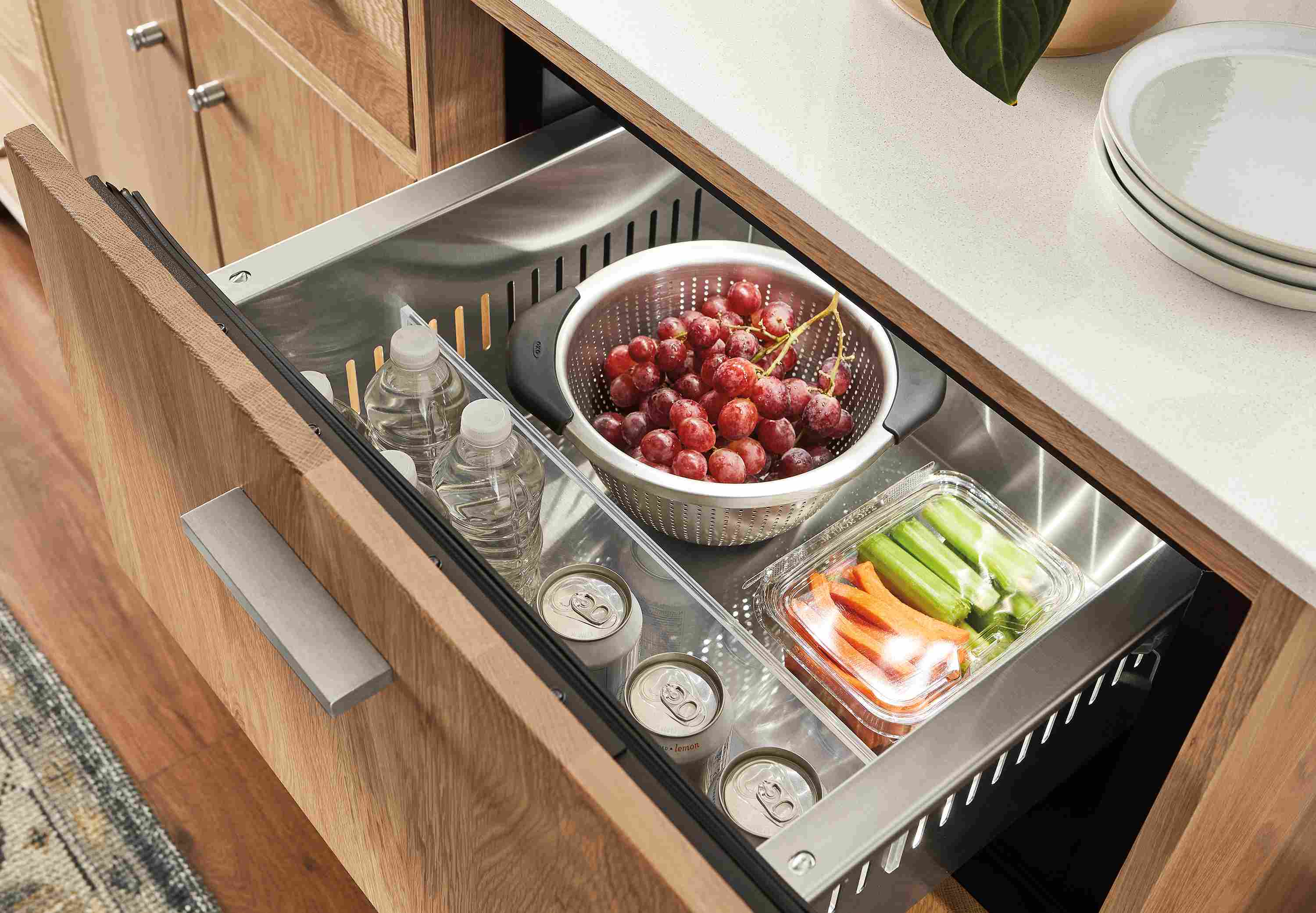 Close-up of Linear refrigerated cabinet in rye on red oak with refrigerator drawer open.