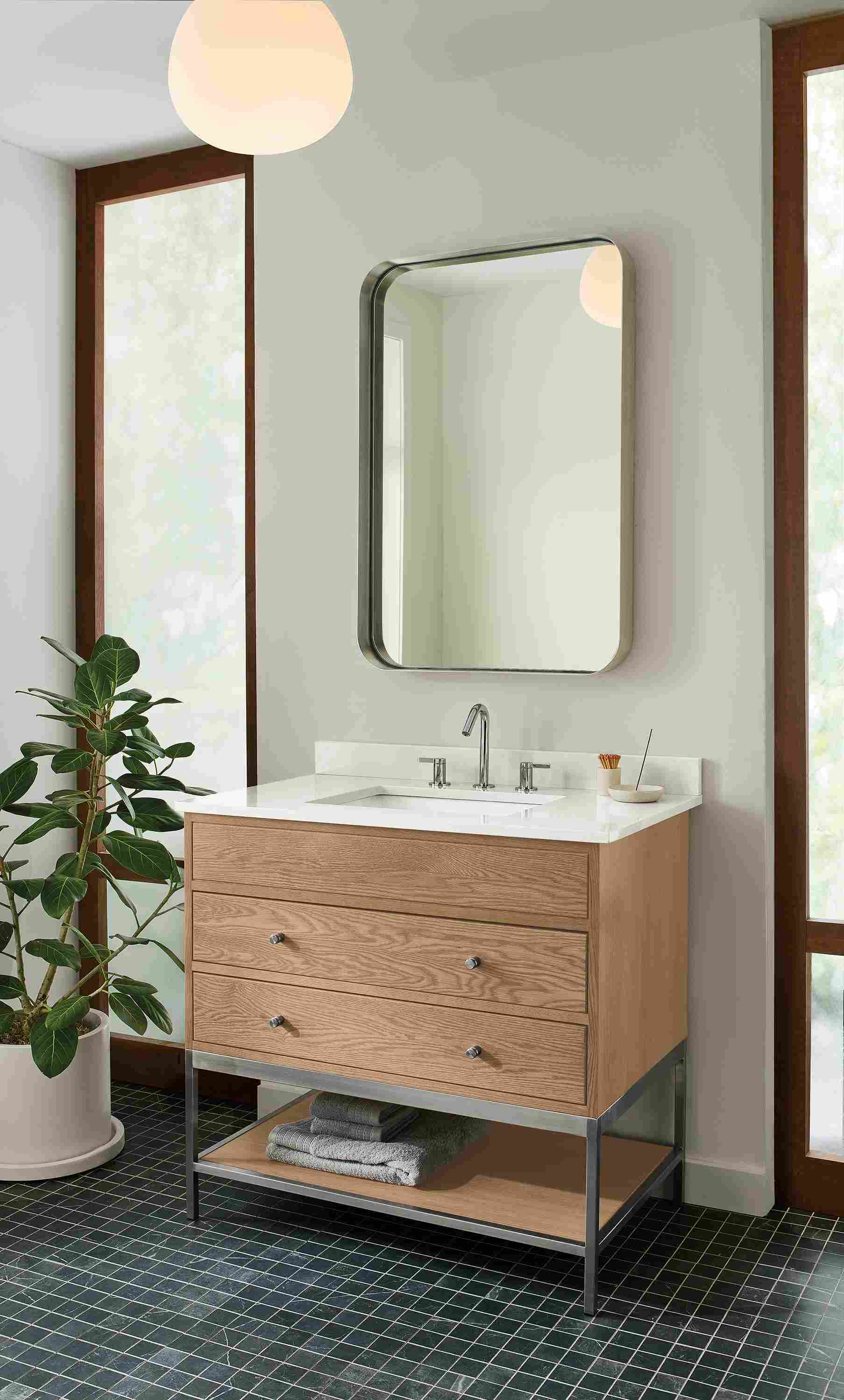 Bathroom with Linear single-sink vanity with drawers and shelf in rye on red oak with light grey quartz.