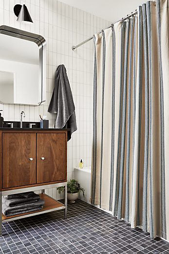 Bathroom with Linear 26-wide walnut vanity and Cameron shower curtain in Natural and Black stripes.