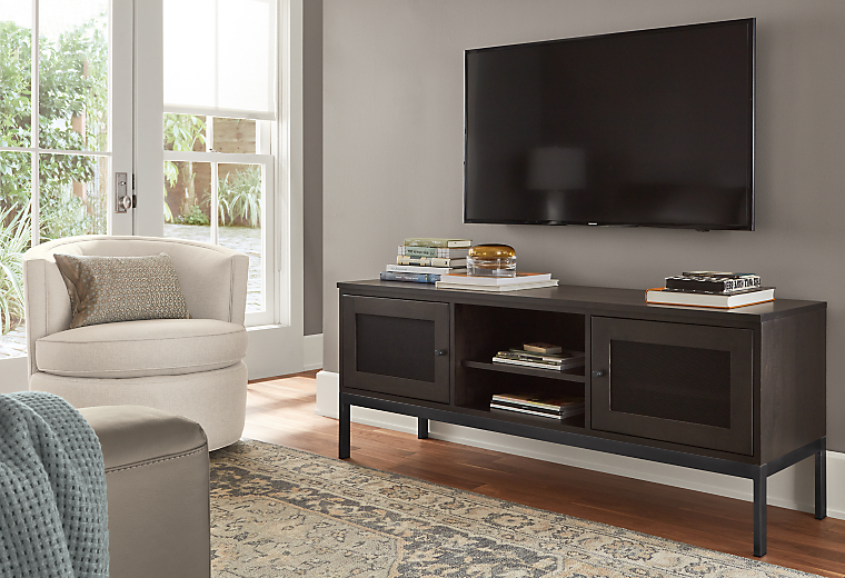 living room featuring linear two-door media cabinet with charcoal stain