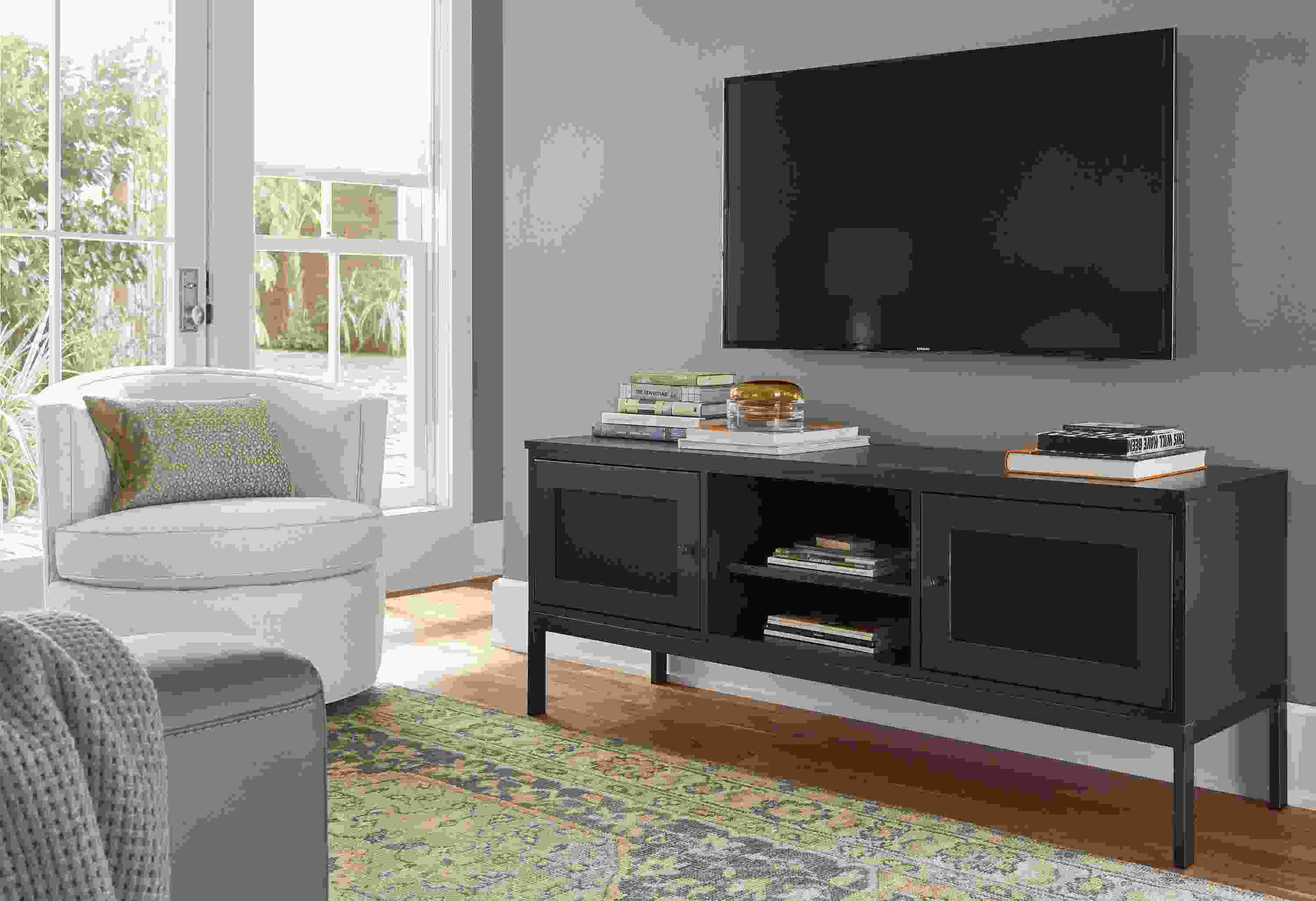 living room featuring linear two-door media cabinet with charcoal stain