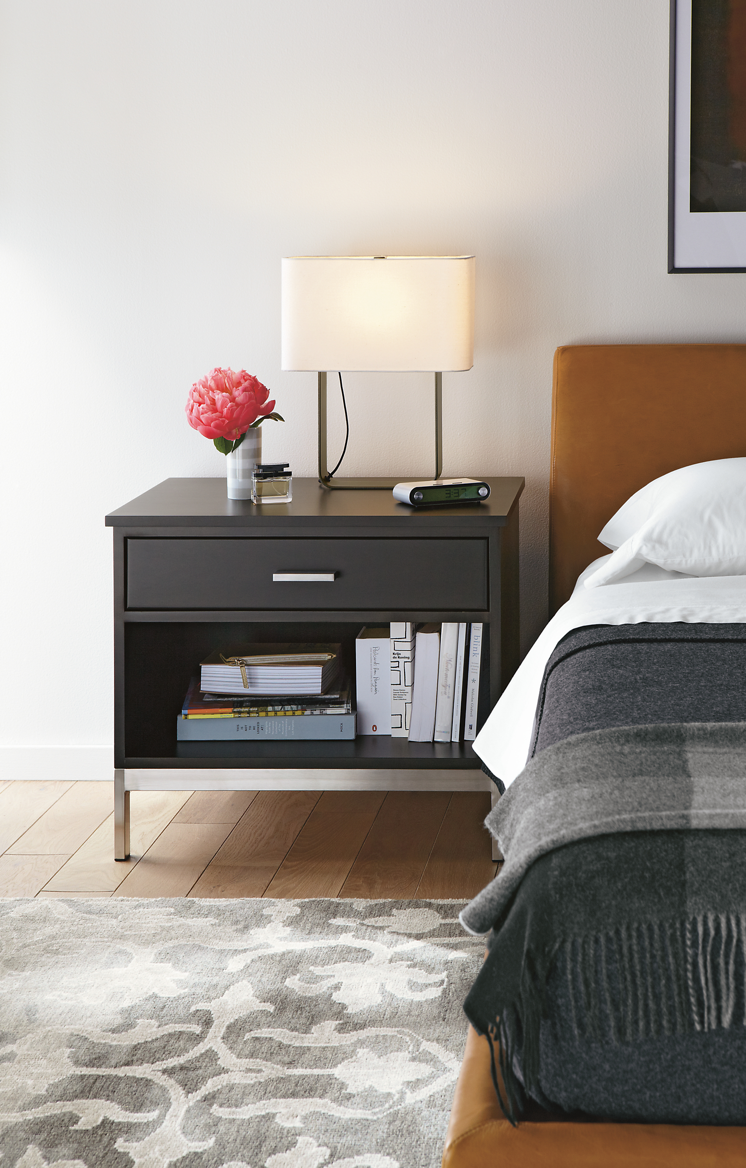 Bedroom with Linear nightstand with steel base in charcoal.
