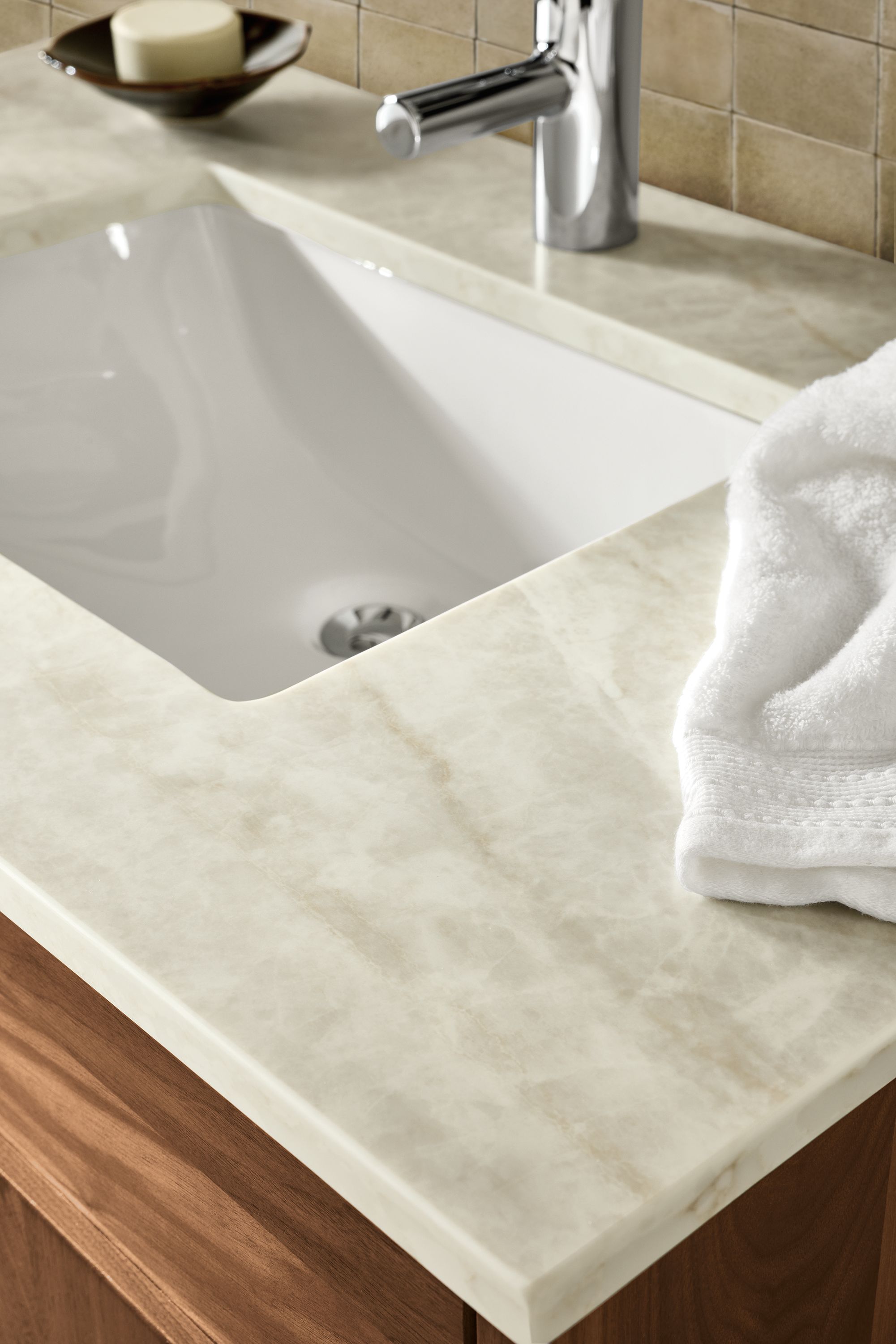 Detail of Mahal Quartz top on a Linear single-sink vanity in walnut.