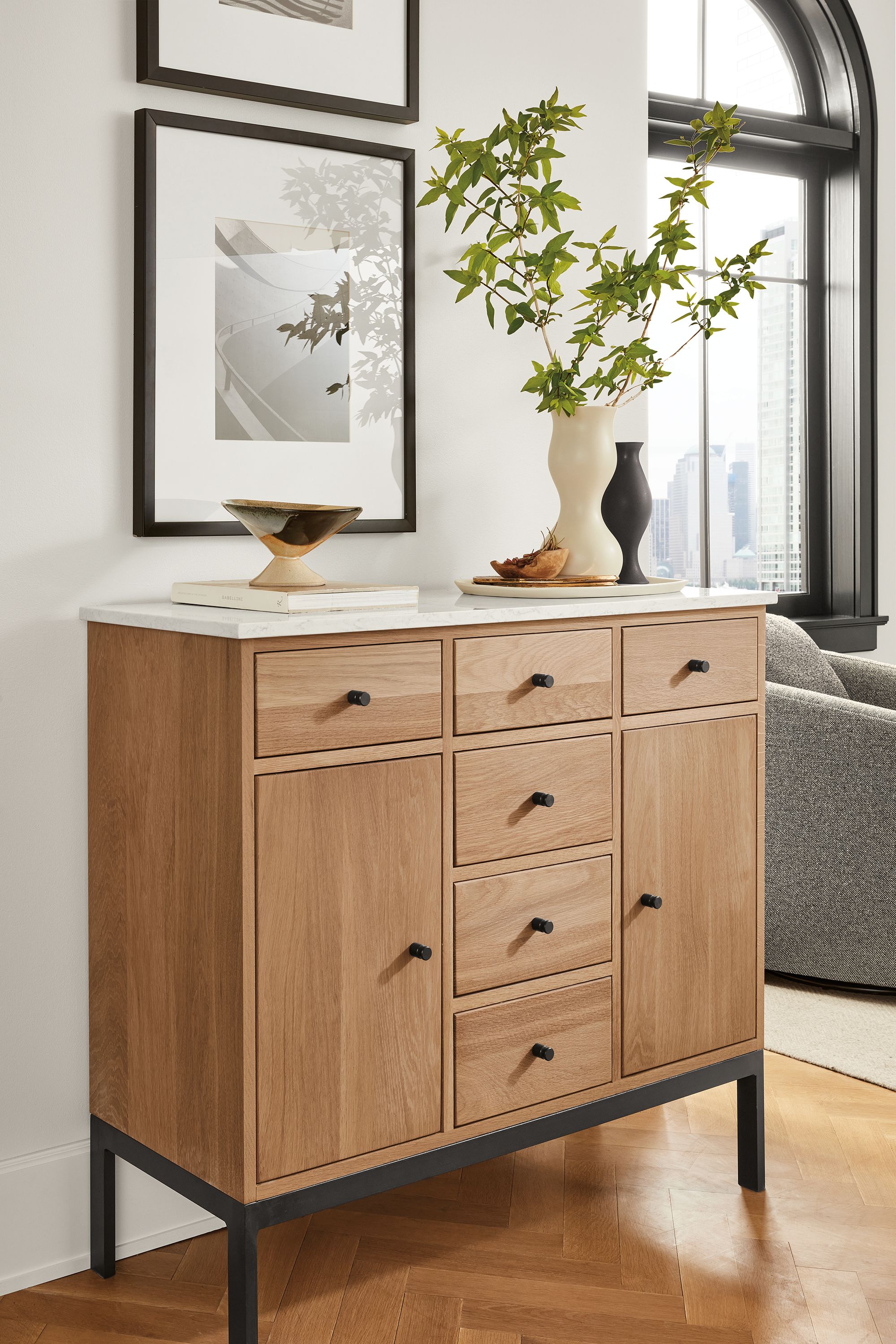 Living area with Linear 42-wide 38-high cabinet in white oak with quartz top and natural steel hardware.