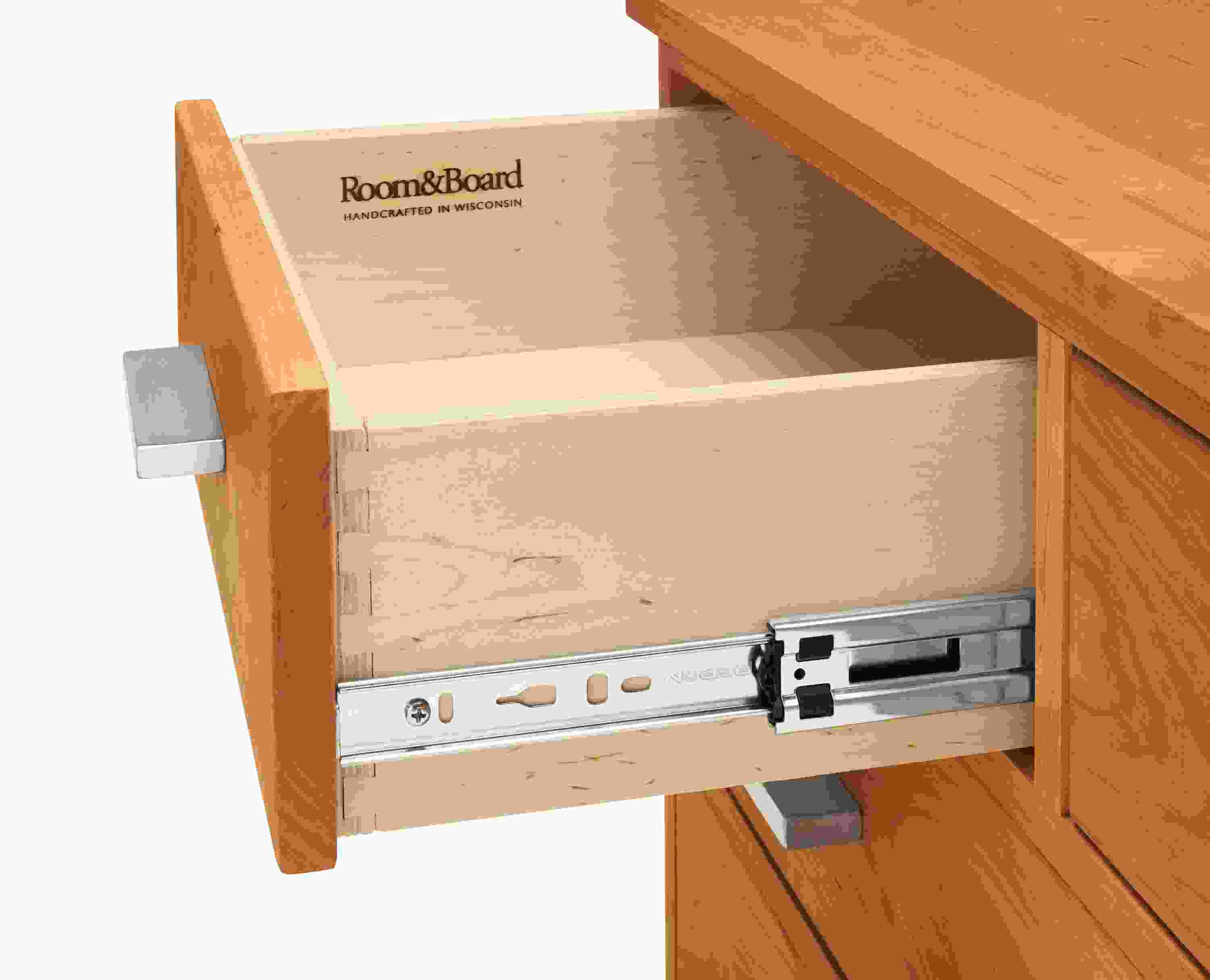 Detail of Linear 36-wide Six-Drawer Dresser in Cherry and Stainless Steel.