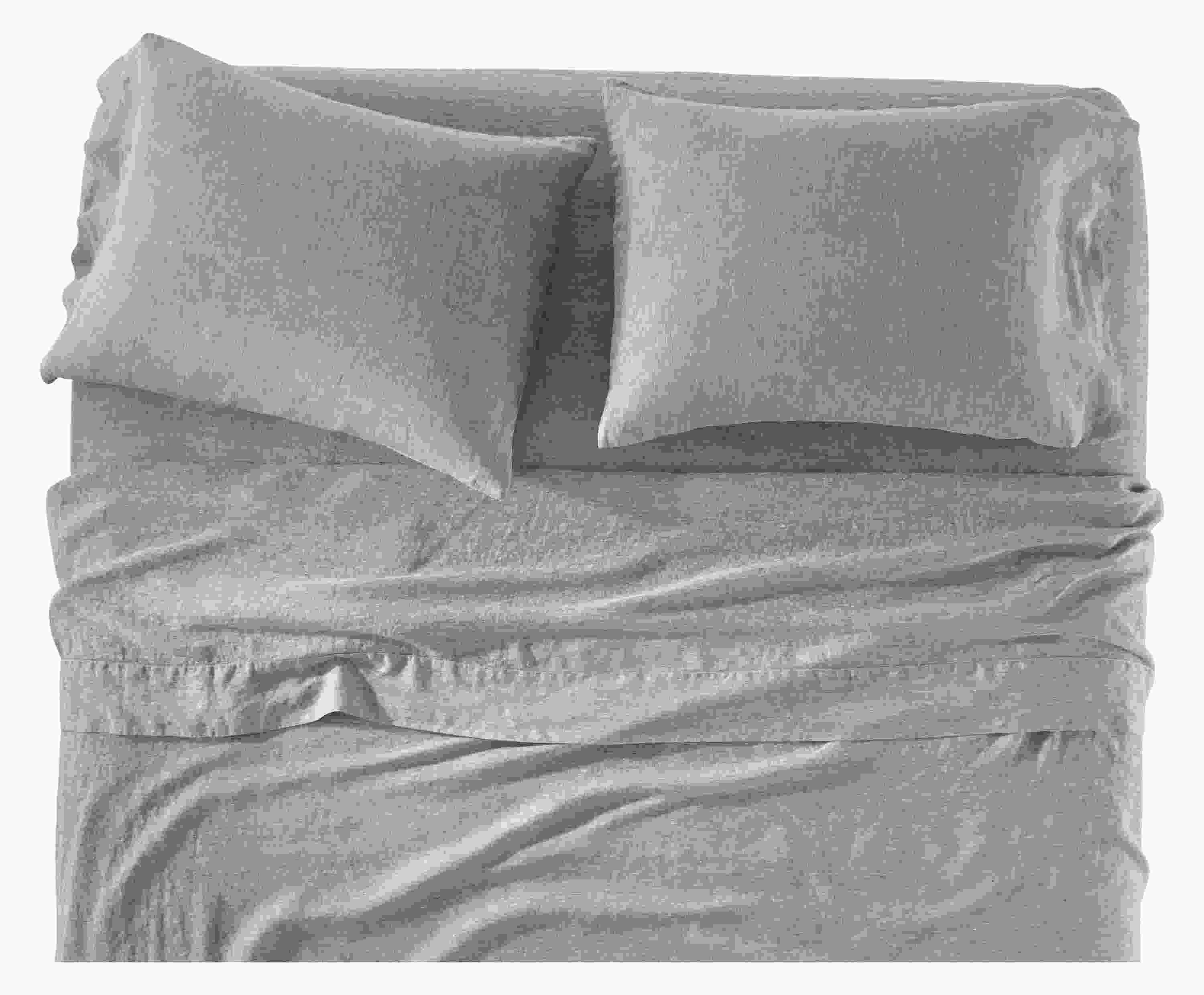 Front of relaxed linen sheet set in blue chambray on bed.
