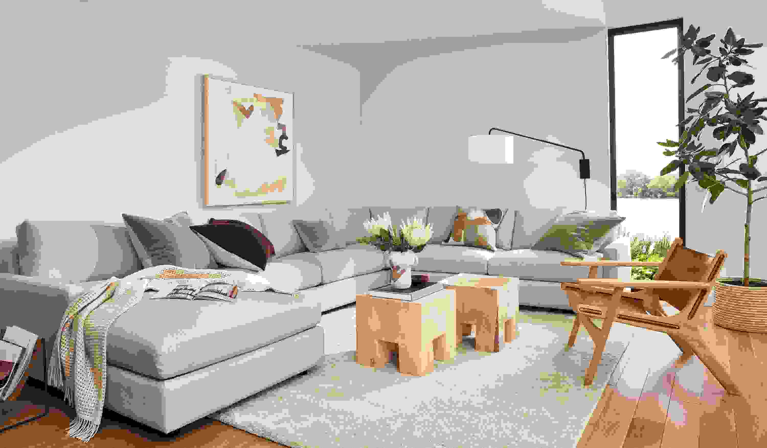 living room with linger sectional, cedro cubes, lars lounge chair, jen garrido wall art.