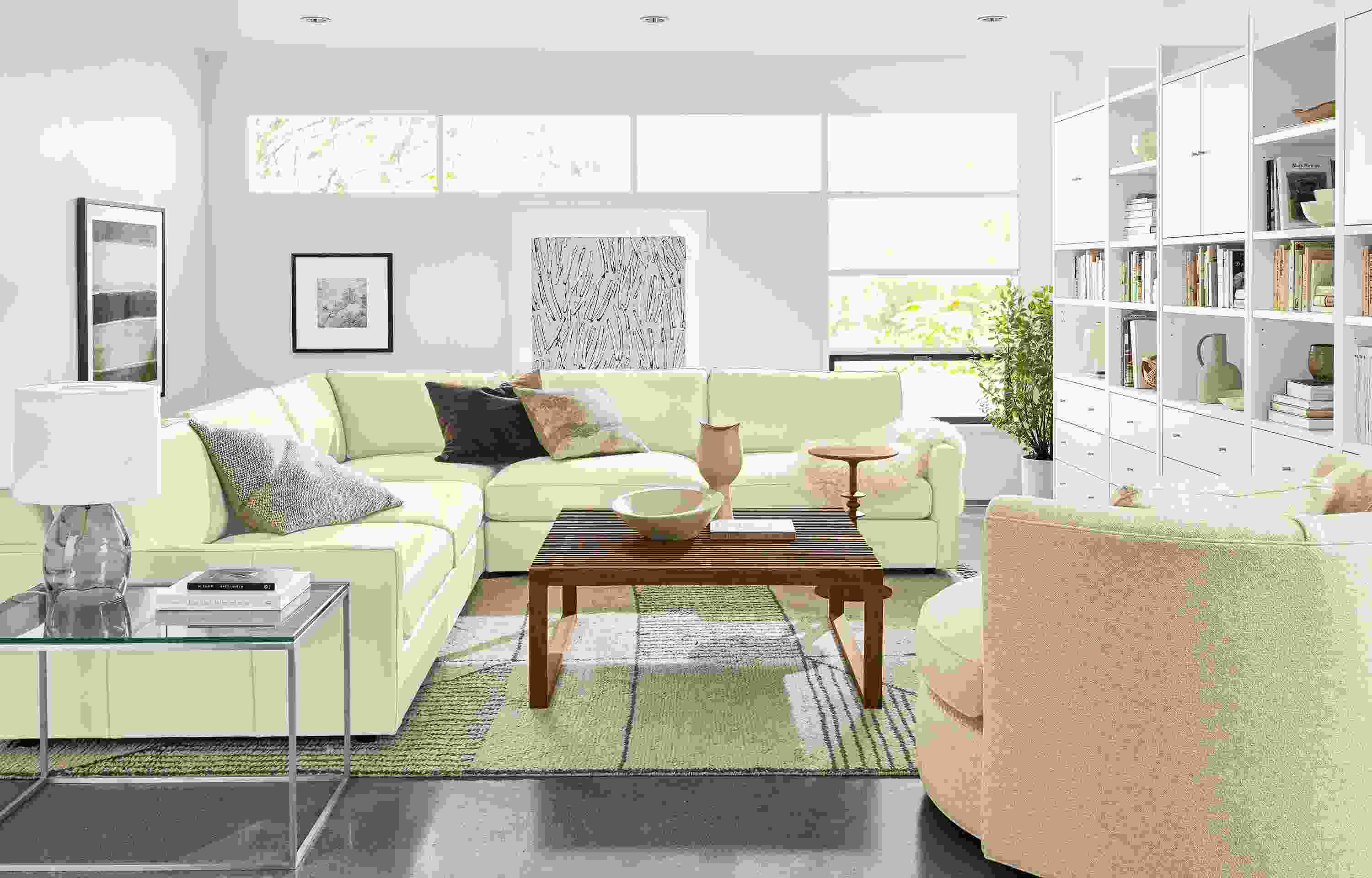 Living area with Linger Deep 119-inch three-piece sectional in Pesaro Ivory and Eos Chair.