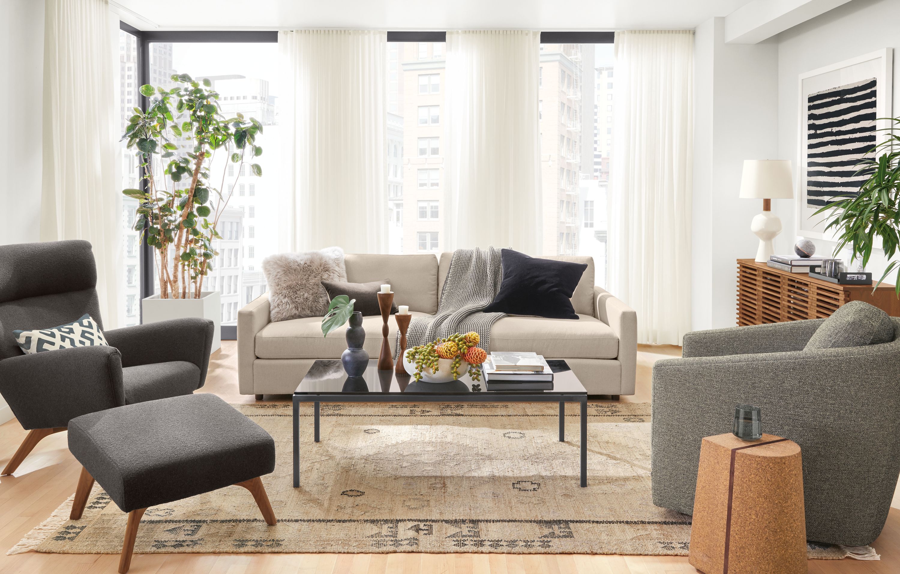 Detail of Linger sofa in Hines Oatmeal fabric in living room with vintage rug.