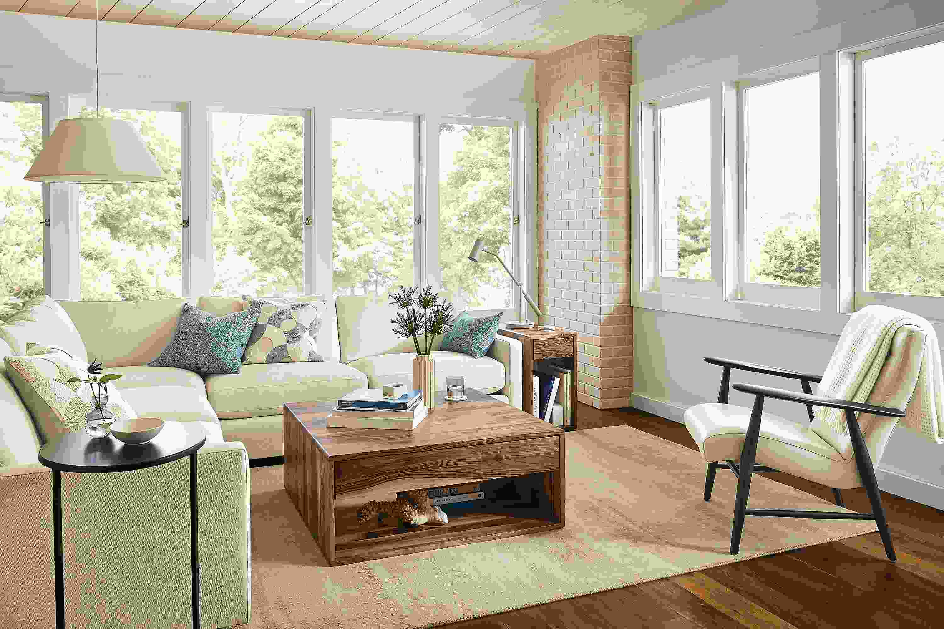 Living room with Linger sectional, Jonas chair, Graft coffee table, Impression rug.