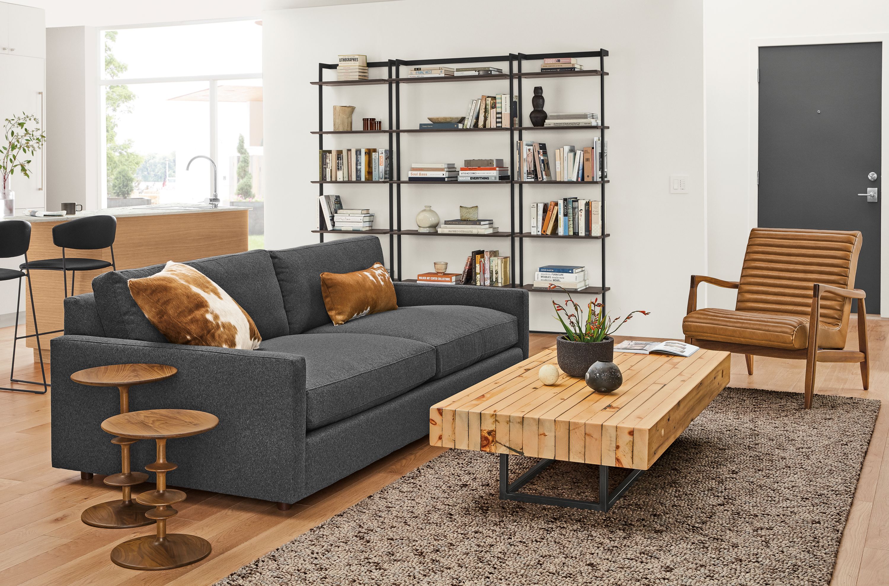 Detail of Linger grey sofa in warm living room.