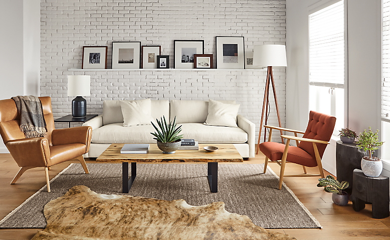Living area with Linger 101-wide deep sofa in sumner ivory, chilton coffee table, Jonas lounge chair and boden chair.