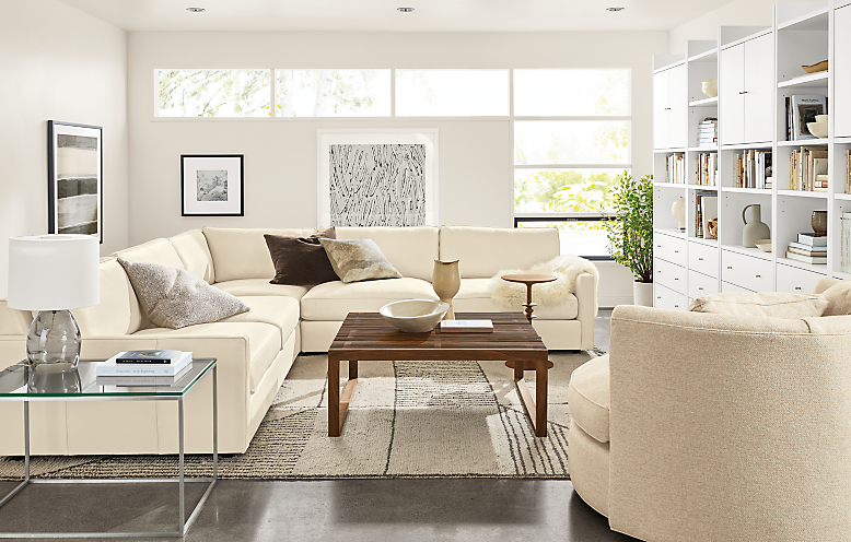 Living room with Linger sectional in Urbino leather in ivory.