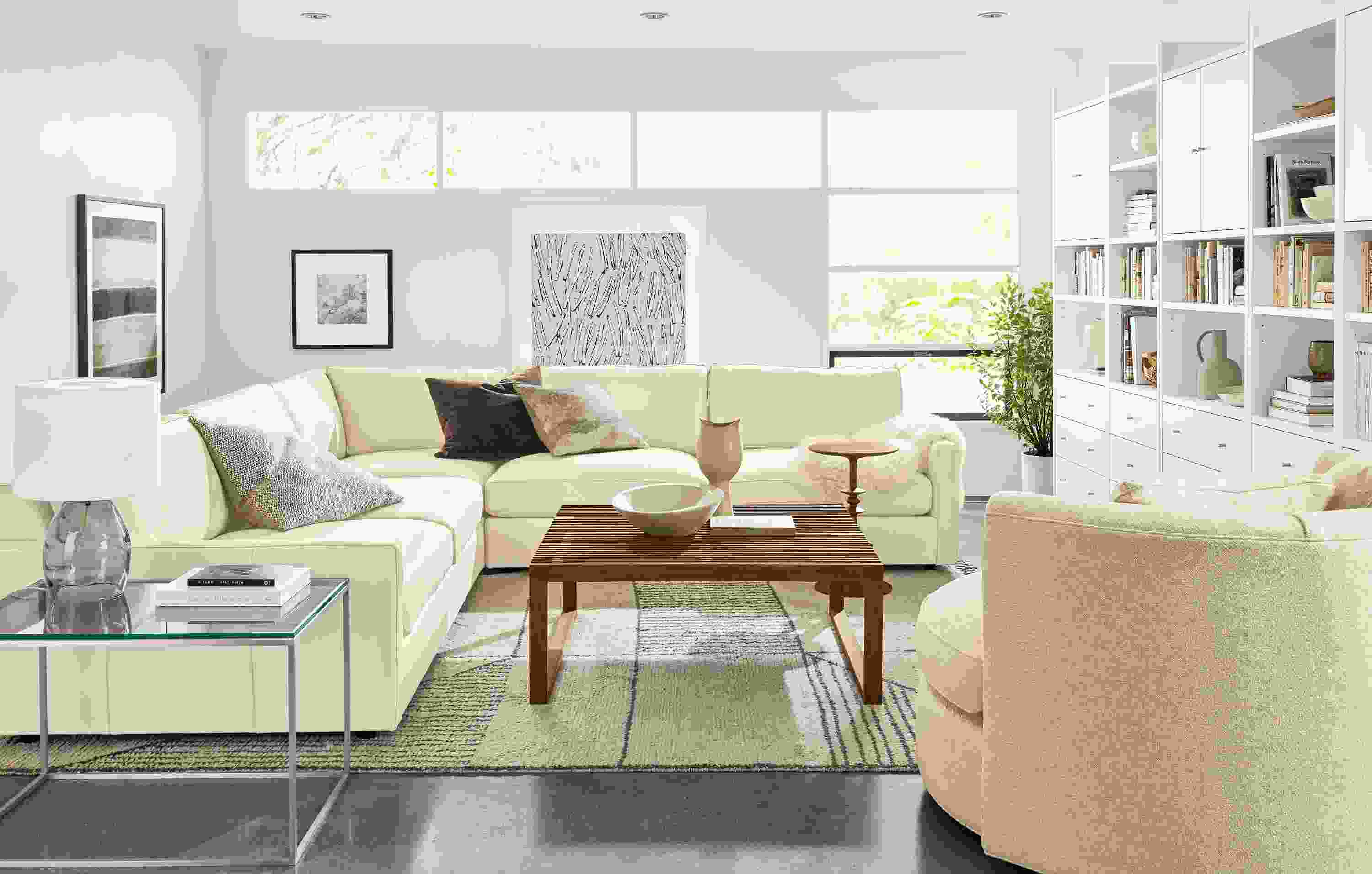 Living room with Linger sectional in Urbino leather in ivory.