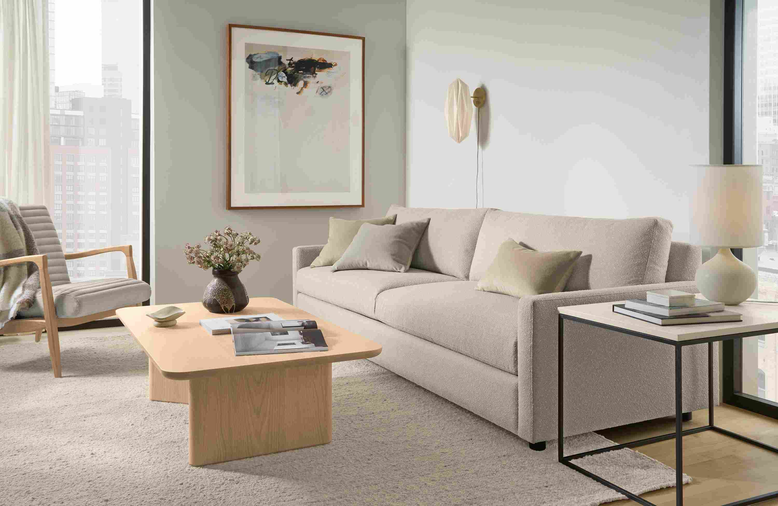 Living room with Linger 101-wide sofa in Declan Natural and Carver coffee table in salt on red oak.