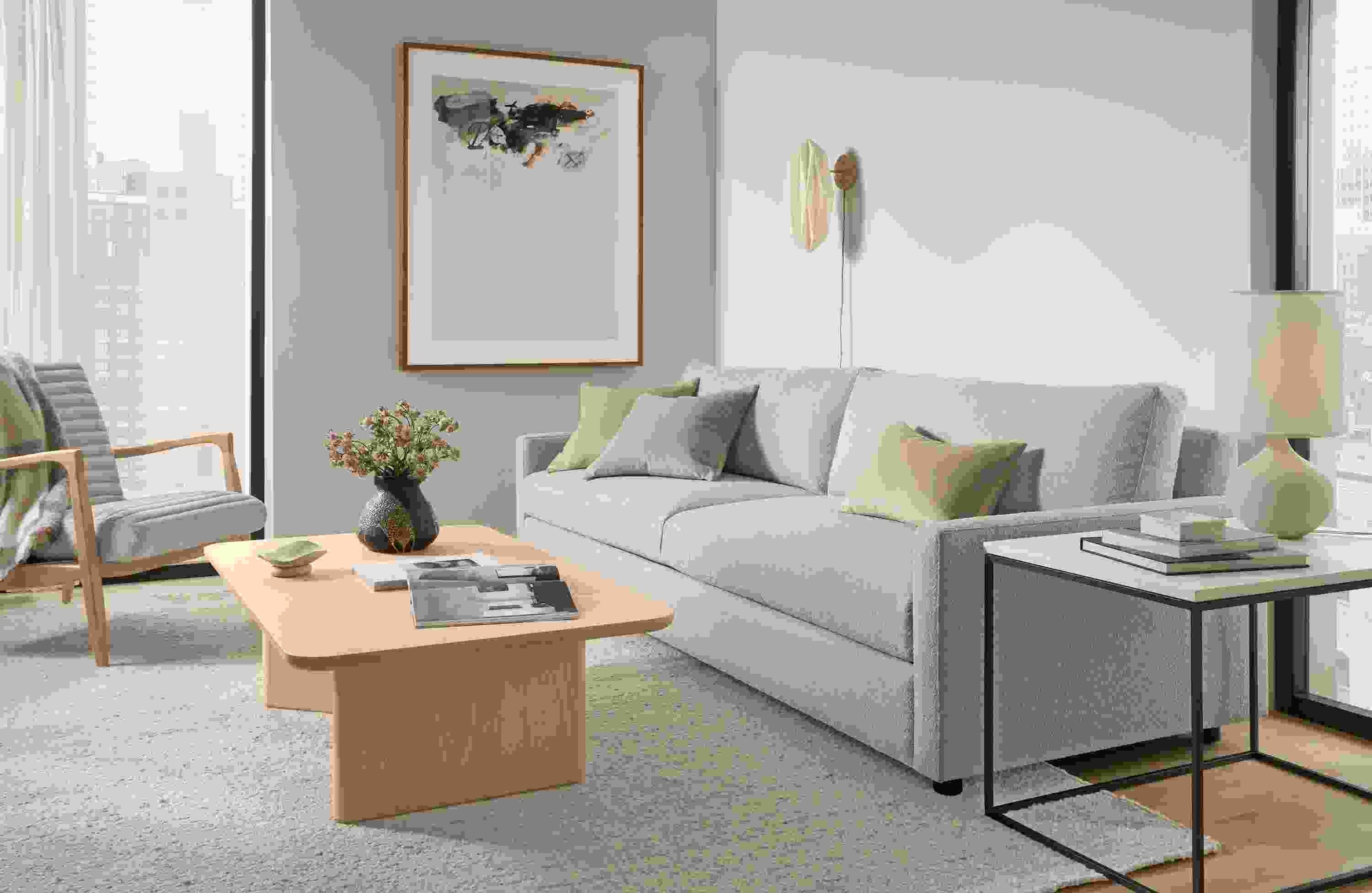 Living room with Linger 101-wide sofa in Declan Natural and Carver coffee table in salt on red oak.