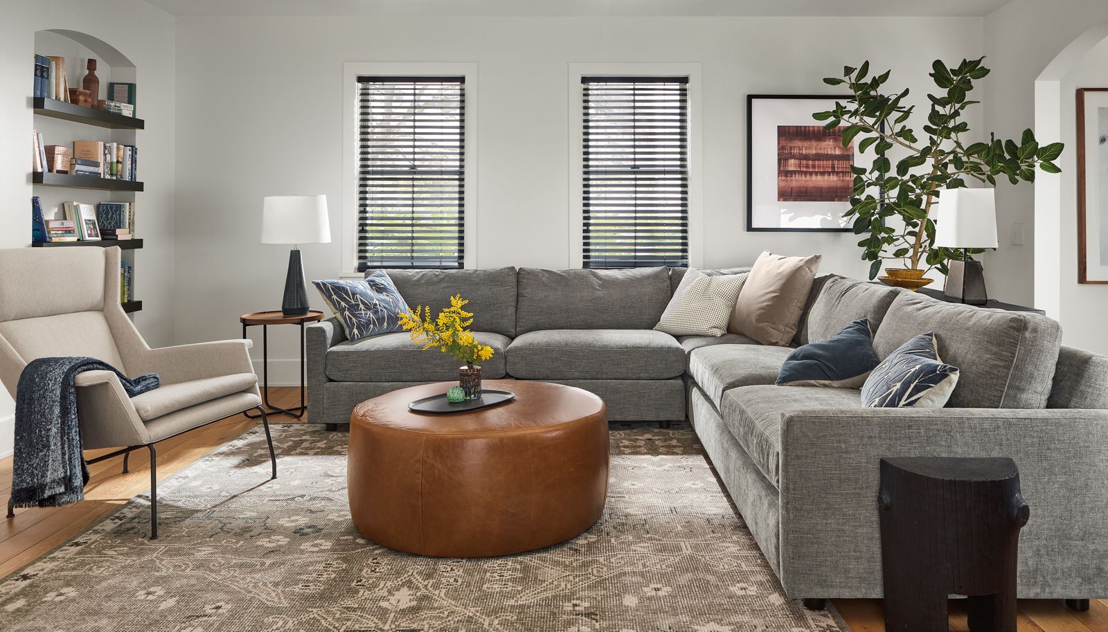 living room with Linger 113x113 Three-Piece Sectional in Mori Fabric, aidan chair, lind ottoman.