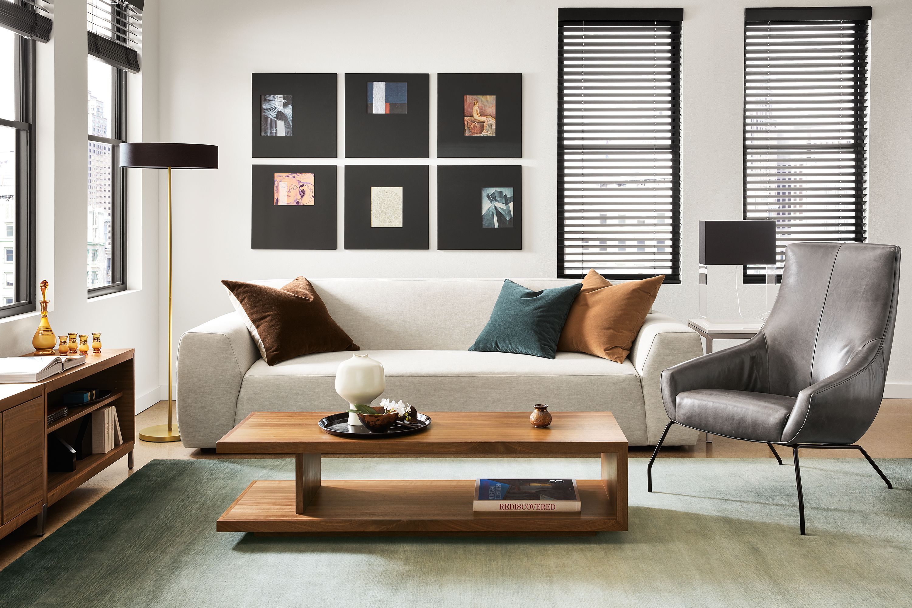 Living room setting with Linville 98-inch sofa in yana natural fabric, Rhodes lounge chair in vento smoke leather and Graham coffee table in walnut.