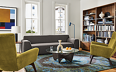 Living area with Linville sofa in Gino charcoal fabric, two Boden chairs in Vance mustard, Sanders coffee table and Heriz rug in ink.