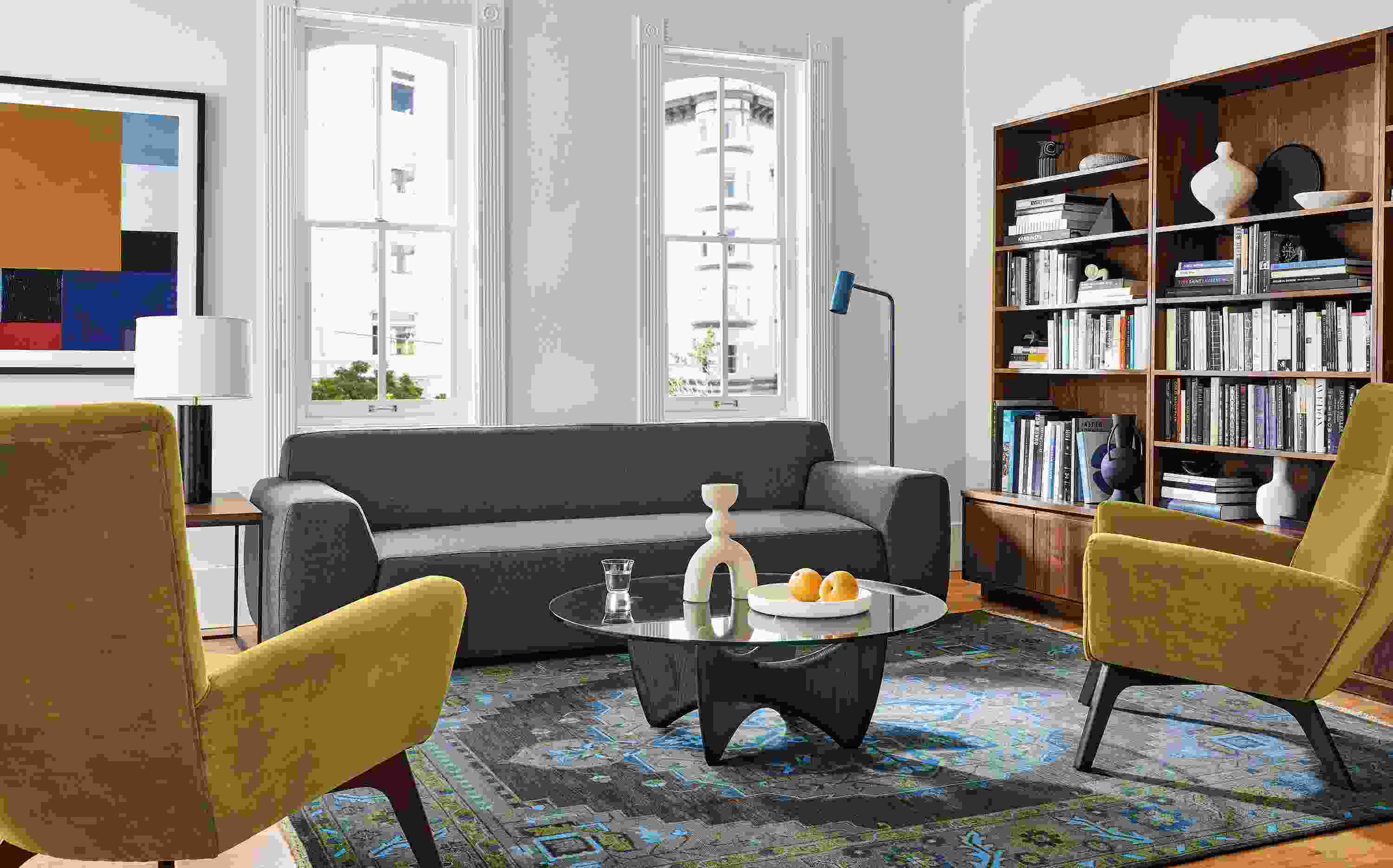Living area with Linville sofa in Gino charcoal fabric, two Boden chairs in Vance mustard, Sanders coffee table and Heriz rug in ink.
