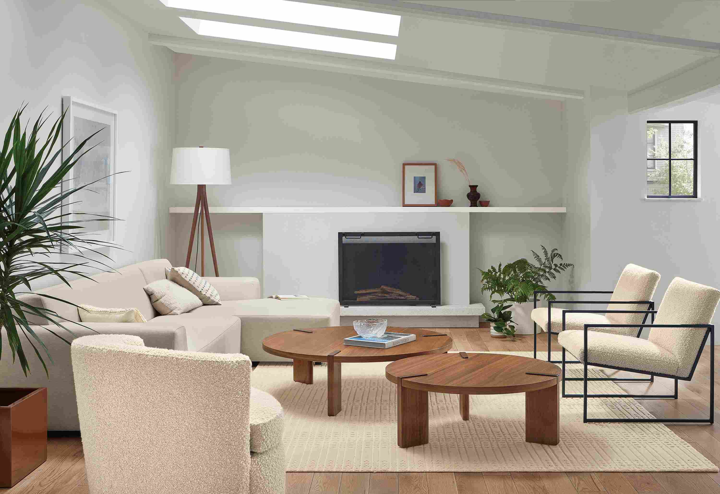 Living room with Linville 118-inch Sofa with Right-Arm Chaise in Yana Natural fabric, 2 Novato Chair in Dornick Ivory, and 2 Hanover Coffee Tables in Walnut.
