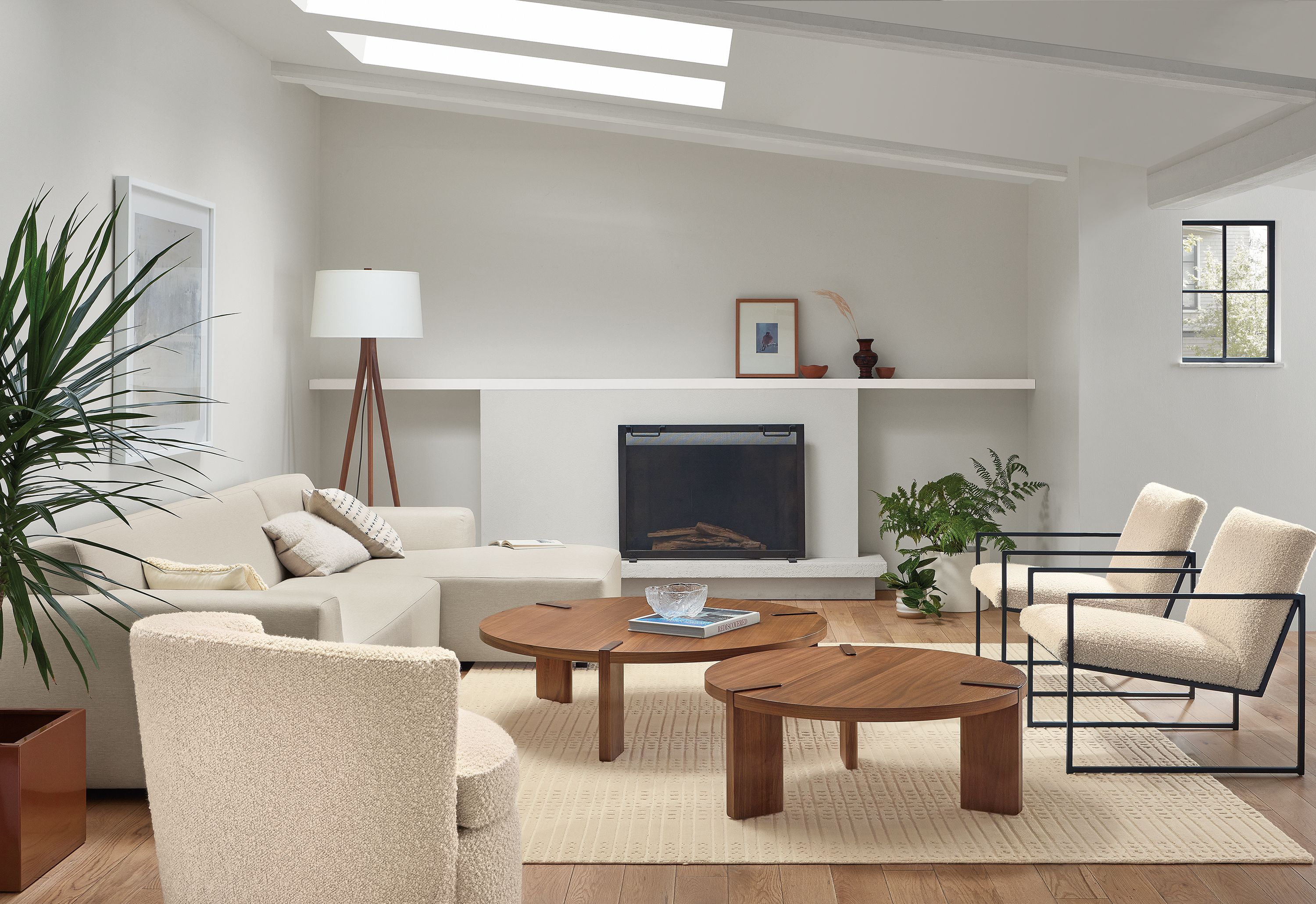 Living room with Linville 118-inch Sofa with Right-Arm Chaise in Yana Natural fabric, 2 Novato Chair in Dornick Ivory, and 2 Hanover Coffee Tables in Walnut.