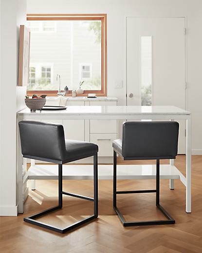 Kitchen with Lira counter stool in Urbino black leather.