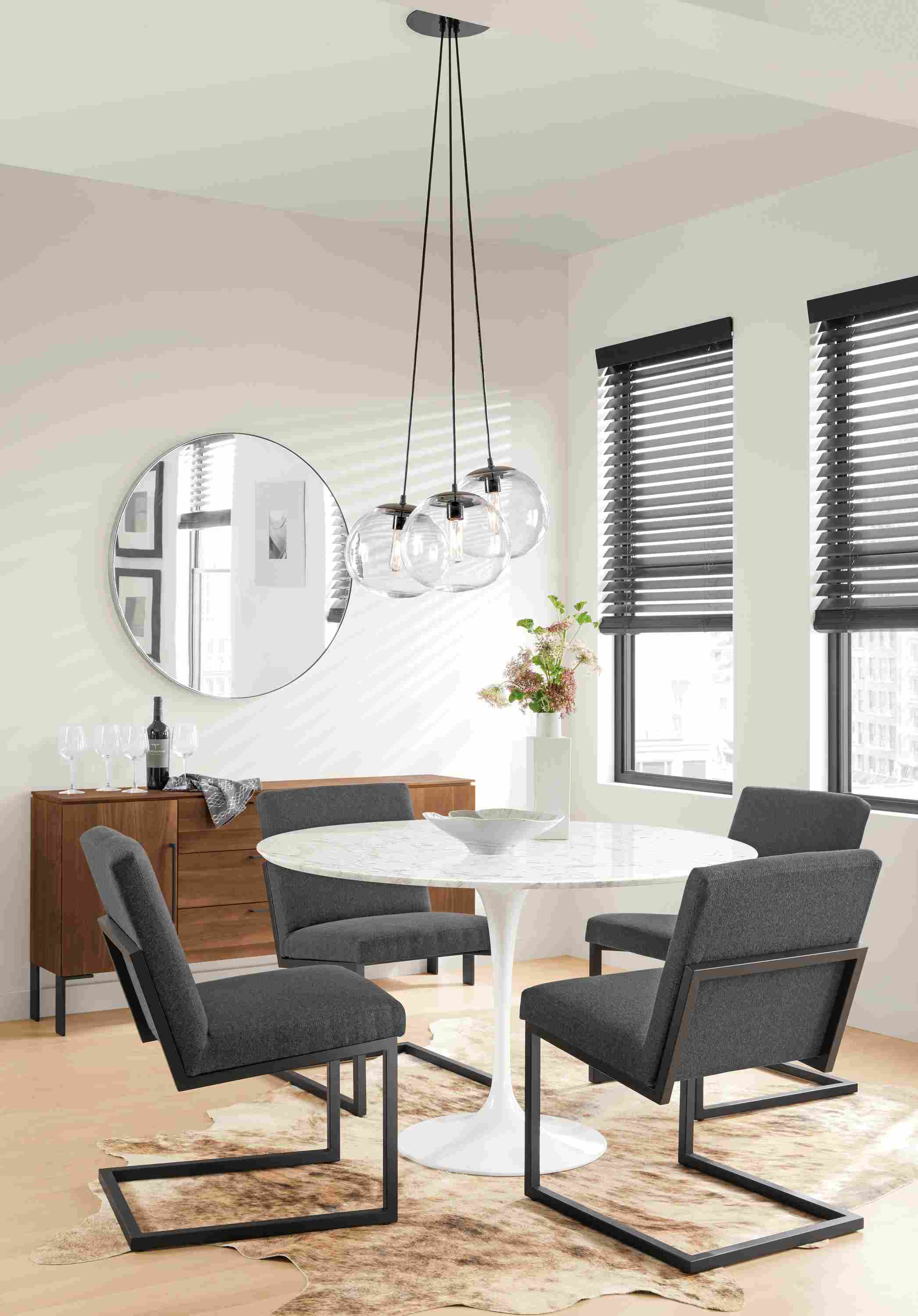 Detail of four Lira side chairs.
