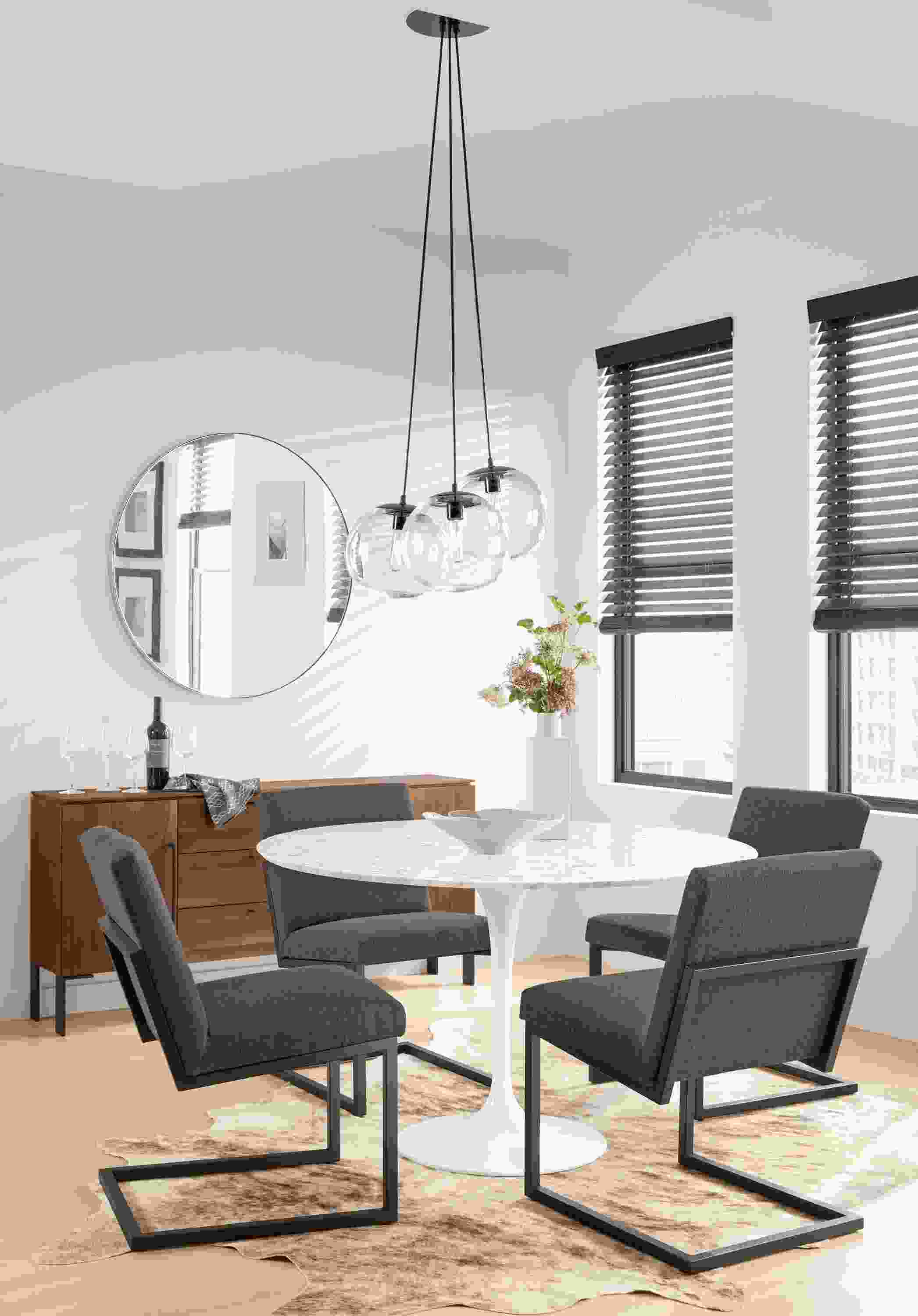 Detail of four Lira side chairs.