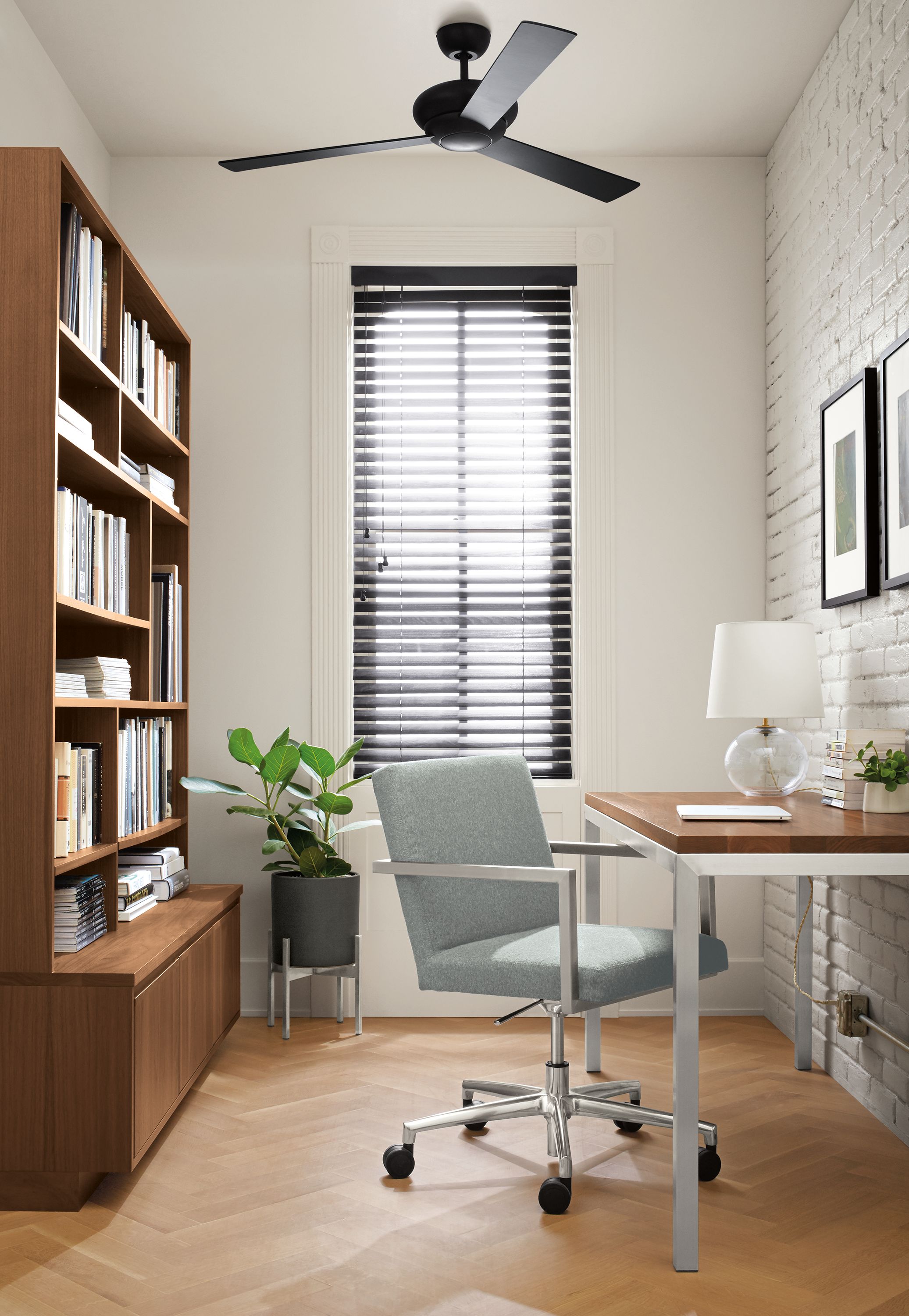 Home office with Lira office chair in Hawkins Cadet and Portica table in stainless and walnut.