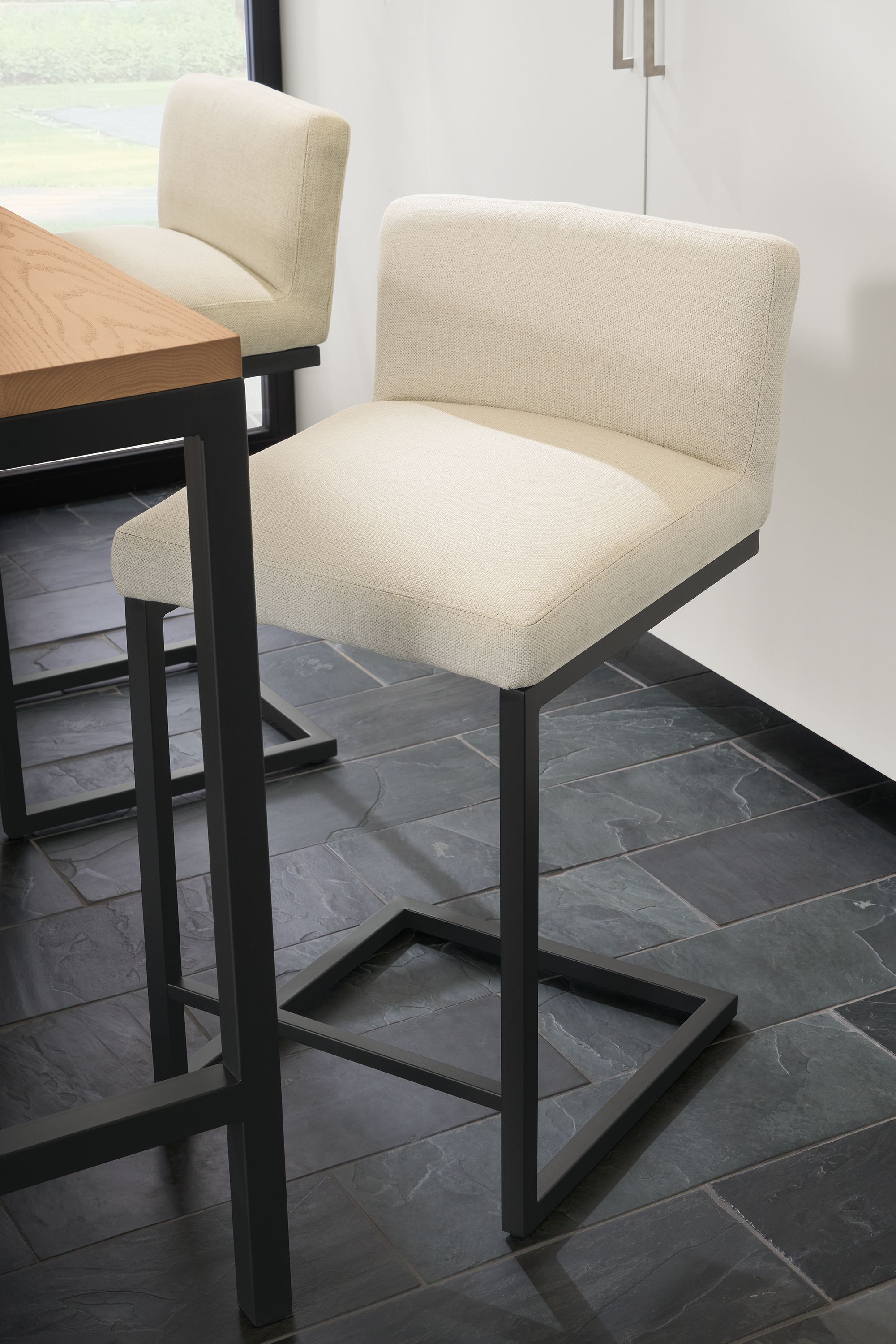 Counter stool in Sumner ivory fabric with graphite base