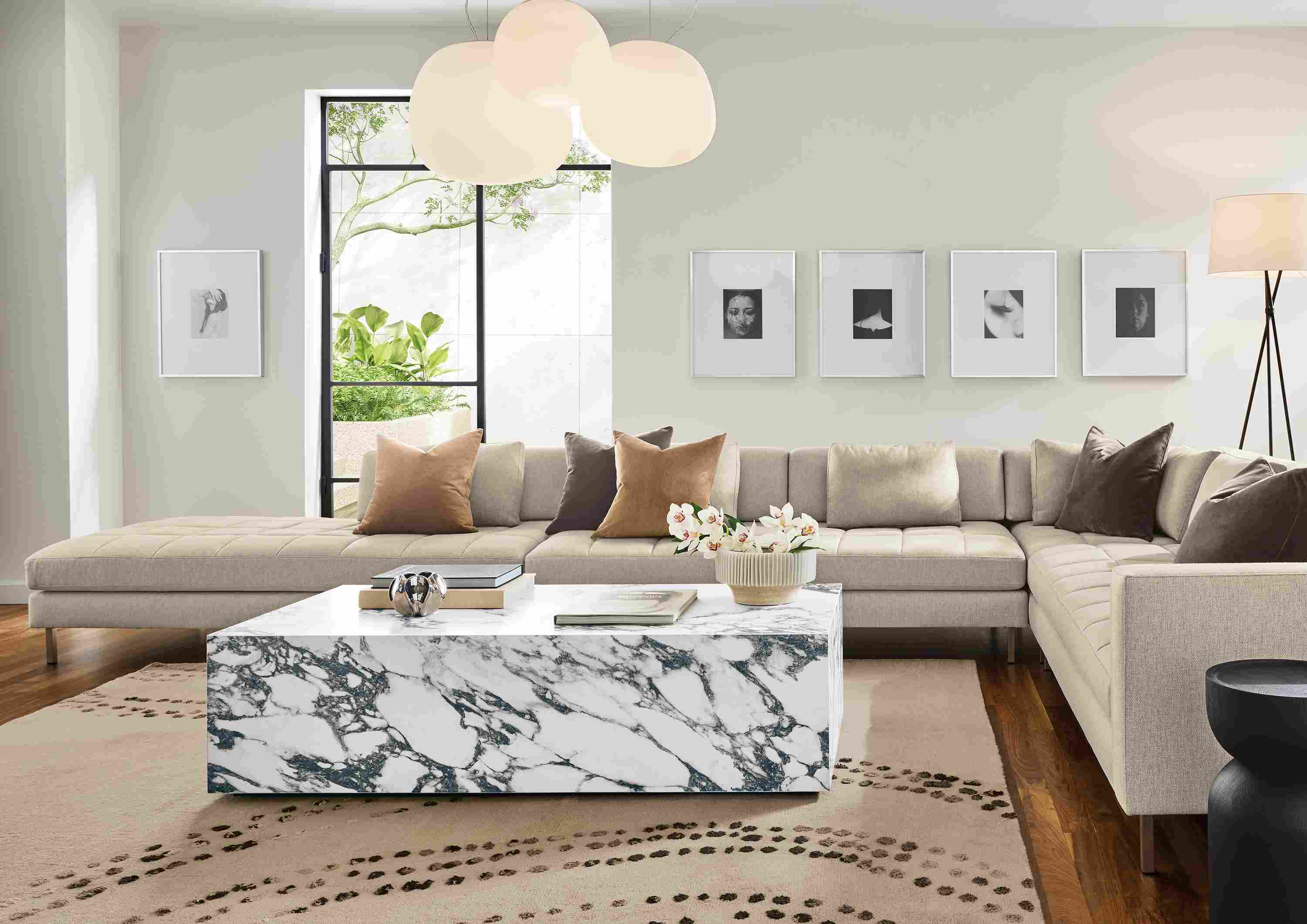 Living room with Lloyd 186-wide sectional sofa in Sumner Linen and Leona coffee table with marbled white charcoal ceramic.