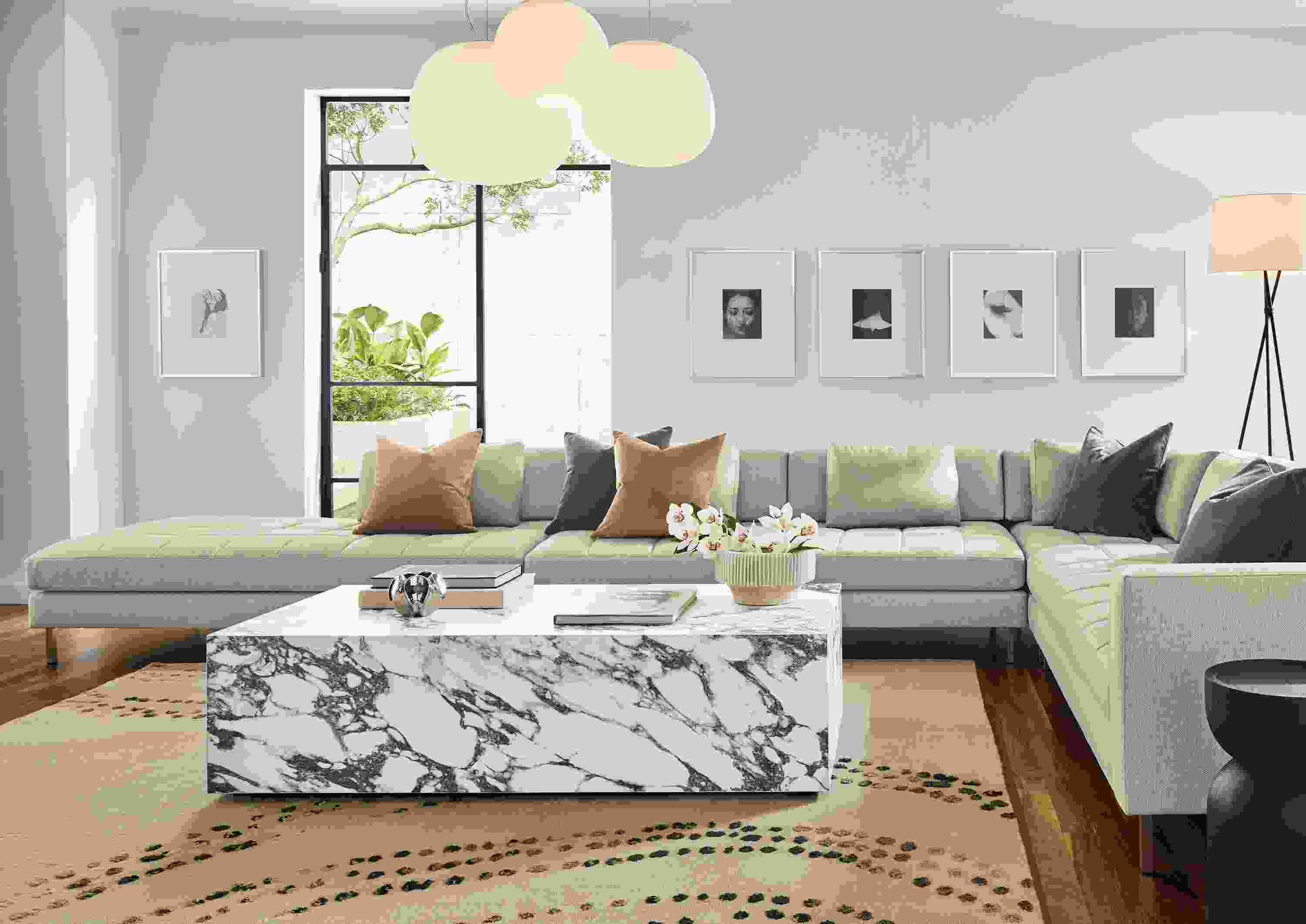 Living room with Lloyd 186-wide sectional sofa in Sumner Linen and Leona coffee table with marbled white charcoal ceramic.