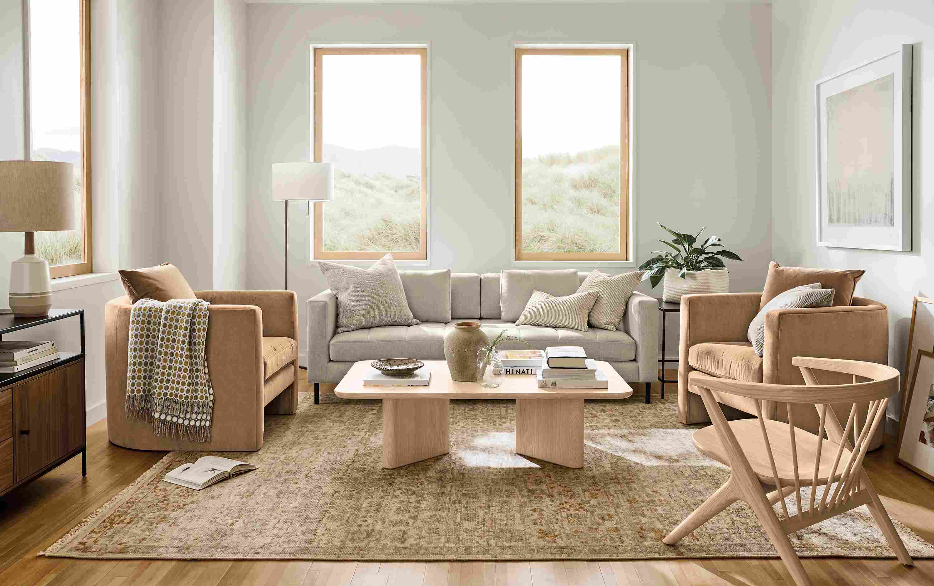 Living room with Lloyd bench cushion sofa in Sumner Linen and 2 Silva chairs in Windsor Cognac.