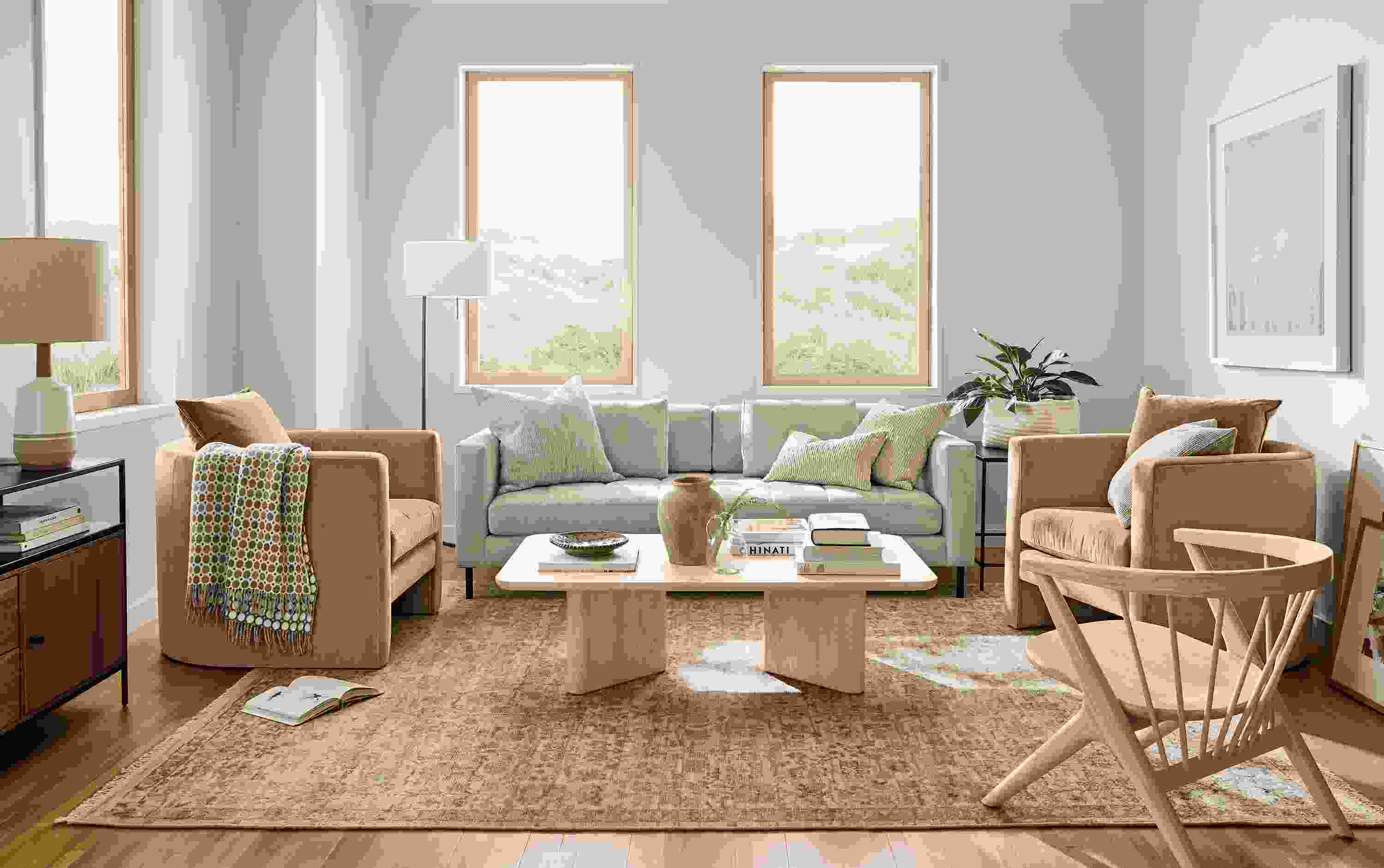 Living room with Lloyd bench cushion sofa in Sumner Linen and 2 Silva chairs in Windsor Cognac.