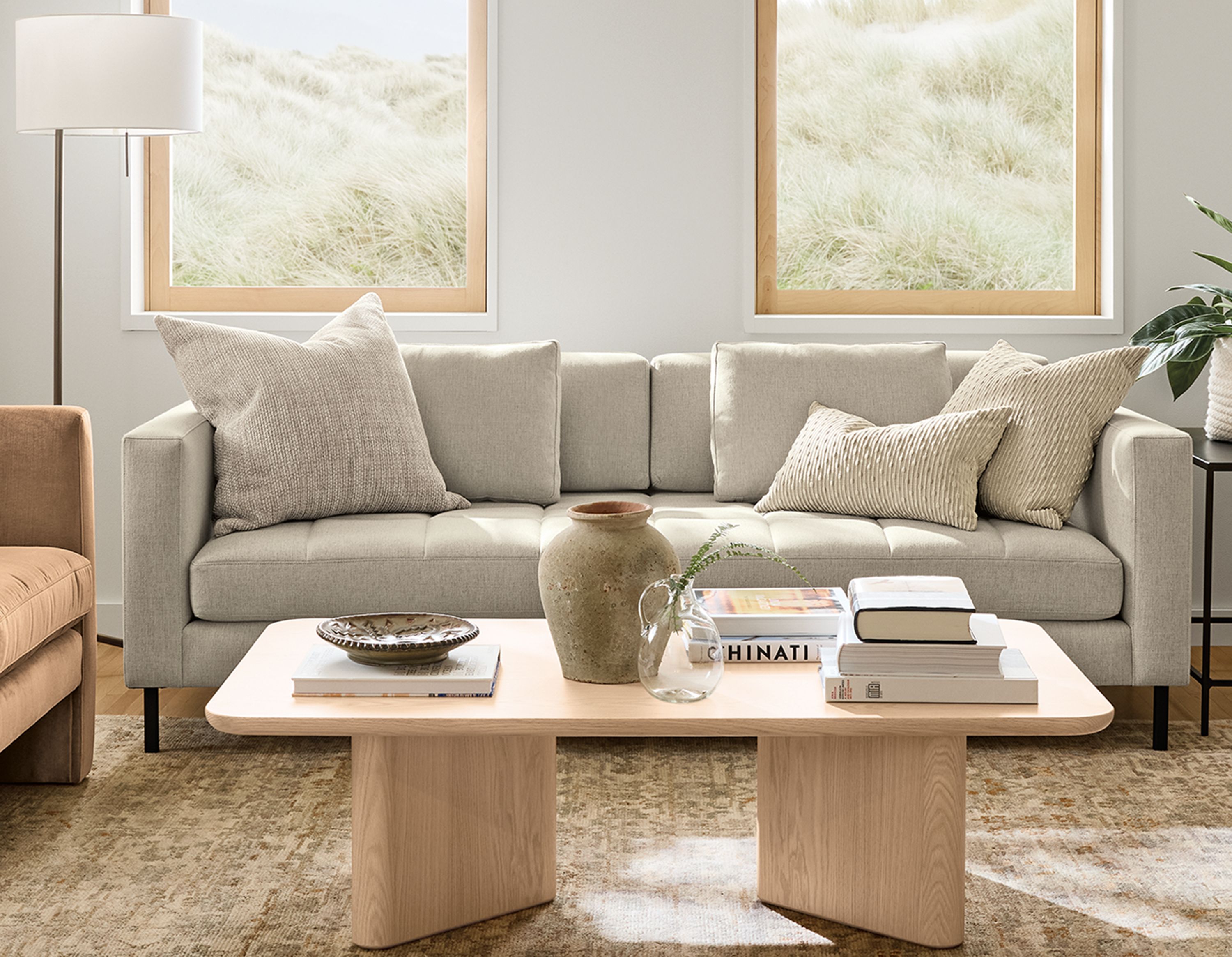 Living room with Lloyd bench cushion sofa in Sumner Linen and 2 Silva chairs in Windsor Cognac.